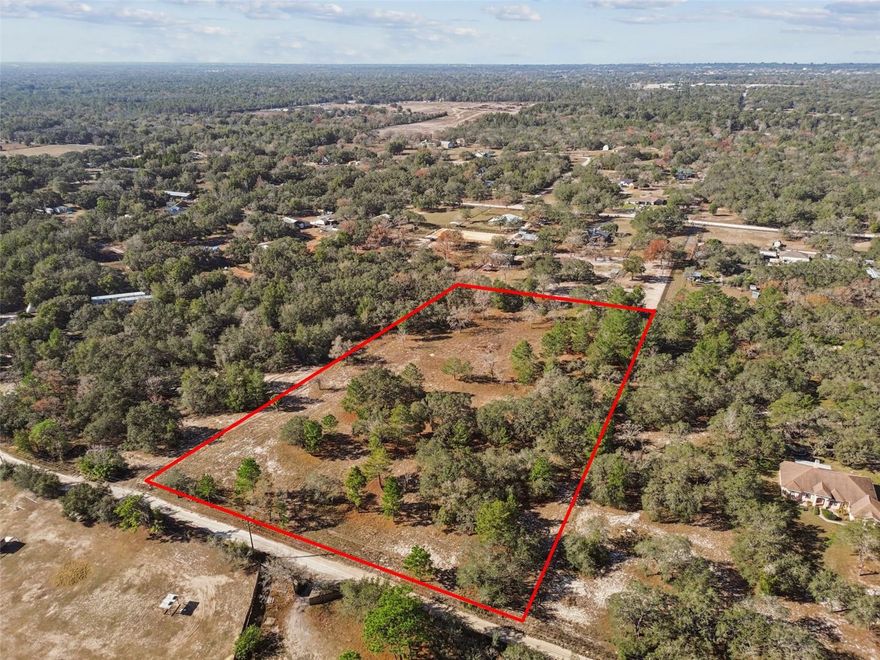 Wow, Over 5-acres of Agricultural/ Residentially zoned land located in the serene setting of Hudson, Florida. Situated on this flat, unimproved parcel, it offers an abundance of space - ideal for various agricultural projects, rural residential living, or future development. The land has a natural landscape, with a diverse array of trees, providing a scenic and peaceful environment. With ample room to cultivate, build, or expand, the possibilities are as limitless. The property's agricultural zoning supports a range of uses from farming to the construction of a dream home surrounded by nature. Although currently unimproved, the land presents a blank canvas for installing utilities and tailoring the space to meet your specific needs.