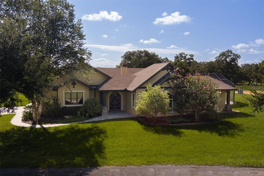 Welcome to this picturesque 15 acre horse farm located practically next door to the renowned World Equestrian Center!  This exceptional farm offers an idyllic retreat for horse enthusiasts of any discipline, combining the charm and serenity of country living with the luxury of close proximity to horse venues and modern conveniences.  Enter through the impressive double front door to a Mediterranean-inspired home; first stop is the courtyard - a tropical paradise which includes seating surrounded by lush plantings, and a giant covered kitchen area with cozy stone fireplace.  The adjoining pool and spa, together with the entire garden area are within a screened enclosure, making this a comfortable and enjoyable area all year-round.  Some of the highlights of this custom home are wrought iron fixtures, crown molding, coffered ceilings, tons of windows, a huge chef's island kitchen, and a luxurious en suite master fit for a king.  The home also features an adorable attached 2 BR/1BA apartment, providing guests, in-laws, or teenagers with their own private space.   The main center-aisle 8-stall barn includes tack/feed room, storage, and a spacious 1 BR/1 BA apartment.  Additional stalls are available in the secondary barn.   There is also a riding arena, round pen, and Eurosizer to round out this fully equipped, and beautifully appointed farm.