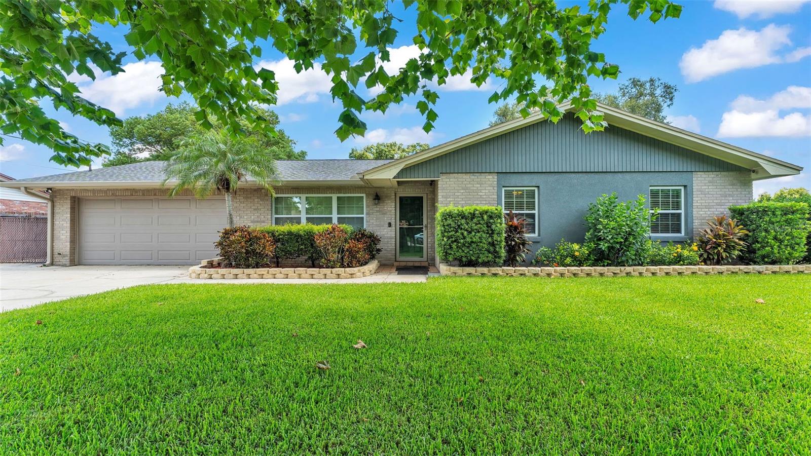 Bring your hobbies, toys, and dreams—this 3 bedroom, 2 bath home has space for it all! Nestled on a .39 acre lot and featuring a versatile floor plan with a living room, family room, den, and a fully equipped kitchen, this home offers comfort and flexibility. The primary suite includes an attached office, perfect for remote work or a private retreat. The house has had many major item replacements in the recent past including the roof, drainfield, almost all of the windows, insulation, ductwork, and more. Step outside to screened lanai with a relaxing hot tub, sparkling inground swimming pool, and a fenced backyard. An air-conditioned, insulated 24x32 workshop with 2 bay doors is ideal for projects or storage, complemented by several additional outbuildings, a 2-car garage, and extended parking & drive space galore. The fenced backyard offers an ample & secure space to play, and it also provides privacy and seclusion. Best of all, there is no HOA to worry about. Situated in a quiet, well-established area, this fabulous find is conveniently located with easy access to shopping & restaurants as well as I-4- making it great for commuters too. Don’t miss seeing this one!