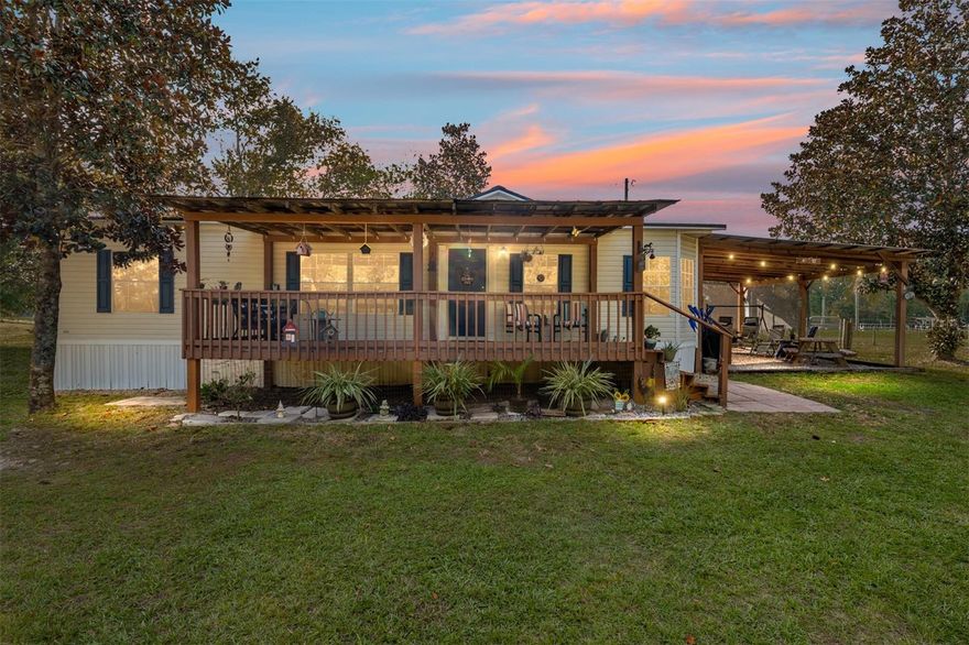 Discover this charming 5-Acre horse property with a pool and outdoor entertainment area. This beautifully maintained 3-bedroom, 2-bathroom home sits on 5 fully fenced and cross-fenced acres and an electric entry gate, perfect for those seeking peaceful country living with modern comfort and an equestrian lifestyle.  The roof is less than a year old, the HVAC System is 5 yrs old, and the well and pressure tank are less than 7 years old.  Step inside to find a warm and inviting interior featuring an open-concept kitchen and dining area, and spacious living spaces. The primary suite is large enough for a king size bed and is complete with a soaking tub, shower, and dual vanities. The kitchen features a large island, and the stainless refrigerator and glass top stove were replaced 4 years ago. The laundry room with washer and dryer is accessed off the kitchen.  Outside, enjoy endless relaxation and fun with a sparkling above-ground pool purchased in 2023 that has an upgraded sand filter and shade sail.  You’ll love spending time on your large front covered porch or outdoor entertainment area with firepit—perfect for hosting gatherings or unwinding while enjoying scenic views of the surrounding pastureland or watching the game.  For horse enthusiasts, the property comes with fencing, cross-fencing, and a run-in shelter, providing safe and convenient accommodations for your equine companions. There are two sheds for ample storage and plenty of room for additional structures, gardens, or other livestock.  This home is ideally situated 5 miles to High Springs, 11 miles to Alachua, and 21 miles to Gainesville.  The best part is you’ll be close to the Gainesville and Alachua County amenities with the added benefit of Columbia County taxes.