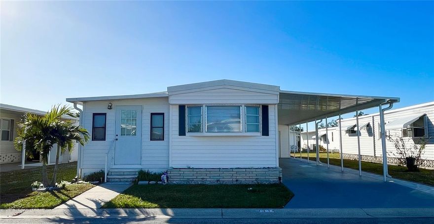 Price Reduced!!  Oakwood Manor - where every day can feel like a vacation in the ONLY Resident Owned Park in the City limits of Sarasota!! This coastal designed remodeled 2 bedroom 1 bath home has been tastefully updated and the additional 200sf attached Florida room is outfitted with a mini split AC unit providing ample space for you and your guest. New kitchen has crown molding, soft close cabinets, granite counters, Whirlpool stainless appliances including a convection oven, farm sink with custom faucet, pantry with pull out shelves. The Luxury Floor & Decor Vinyl plank flooring throughout gives a coastal cottage feel. 3/4" plywood subfloors and new vapor barrier. New exterior doors, Behr paint throughout, new lighting, updated outlets and switches. The bathroom features a newer vanity with Corian counter, newer Bath Fitter step in shower and newer stool. Newer washer/dryer and utility sink are located in the spacious shed. 
Additional updates include a TPO Elastomeric Roof Over 2022, Updated interior breaker box and exterior main panel 2022. Plumbing is updated with pvc, pex and shutoffs. Decorative pavers along the carport showcase this well maintained home.  Partially furnished. 
The gated 90 acre community boasts a low maintenance fee with its vast amenities starting with the spacious Clubhouse outfitted with a full commercial cook kitchen, event stage, audio/visual, dance floor, state of the art fitness room, activities hall, library with books/movies/puzzles and a pool table. Outside recreation includes an extra large heated pool with a handicap ramp, a spacious kidney shaped hot tub, ample umbrella tables and lounge chairs and updated shower rooms. Oak trees shade the beautiful park area, picnic tables and a community grill. Additional amenities to enjoy are the community putt putt course, bocce ball, ping pong, horseshoes and corn hole. Oakwood Manor is a vibrant community with numerous social events and activities. Conveniently located adjacent to Legacy Trail and 12 newer pickle ball courts. Just a short drive to our crystal sand beaches, downtown area, the marina, fishing pier, local golf courses, shopping, variety of restaurants, the museum, SRQ airport, SMH and Doctors hospitals. Please note that Oakwood is a 55+, no pet, no motorcycle Park.