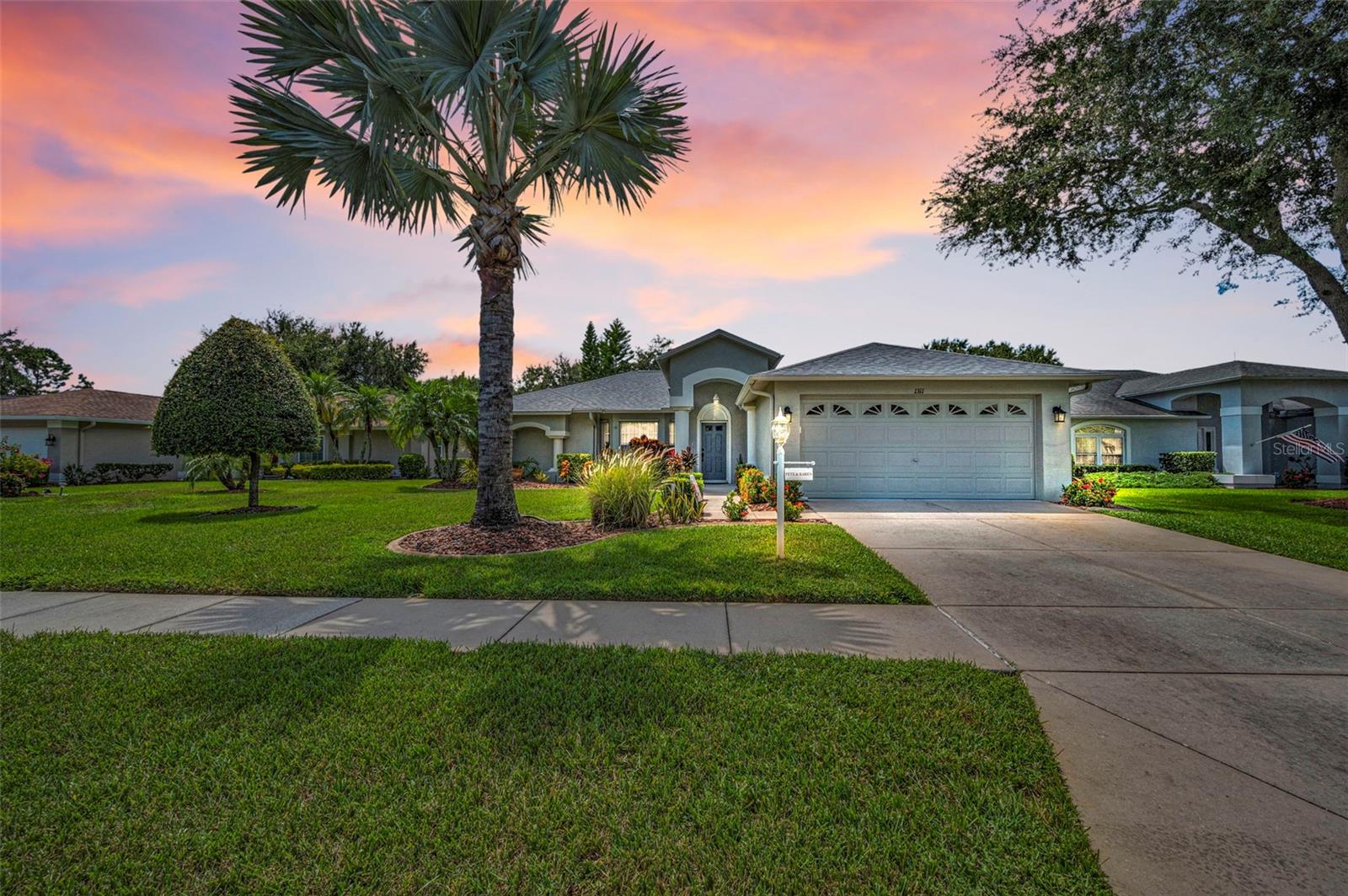 Pride of ownership shows in this 3 Bedrooms, 2 Full Baths, 2 Car Garage home! Once you arrive you will notice the lush landscaping w/curbing that brings you to the front door. As you enter into the home you have soaring vaulted ceilings in the formal living room w/bay window and the formal dining room w/sliders to the enclosed lanai. The kitchen has wood cabinets w/pullout shelves, granite counters, stainless steel appliances, recessed lighting, engineered wood flooring, pantry closet, breakfast bar and a wonderful breakfast nook area. The kitchen overlooks the family room w/vaulted ceiling w/ceiling fan and engineered wood flooring for easy care. There is a hallway w/two closets that leads you to the two guest bedrooms that have carpet & ceiling fan. The guest bathroom has wood vanity w/solid surface counter and tub w/shower. The primary bedroom has plenty of room for all your pieces and it has carpet, ceiling fan, two walk in closets. The primary bathroom has wood vanity w/dual sinks and walk in shower. The laundry room has cabinets, washer, dryer and a utility sink. The garage has pull down staircase, shelving and cabinets. There is a large, enclosed lanai w/tile flooring, ceiling fan & TV that you and your guests will enjoy. Just outside the enclosed lanai you have a patio to grill out and to take in our great Florida weather. This home offers newer items including roof, water heater, kitchen appliances, washer, dryer. This community offers many events & activities that your social calendar will always be full! A gated community w/golf course, tennis courts, pavilion w/picnic tables, grills, bocce, horseshoes, shuffleboard, club house w/restaurant, lounge, performing arts center, billiard & game room, arts & crafts room, library & computer room, heated pool & spa.