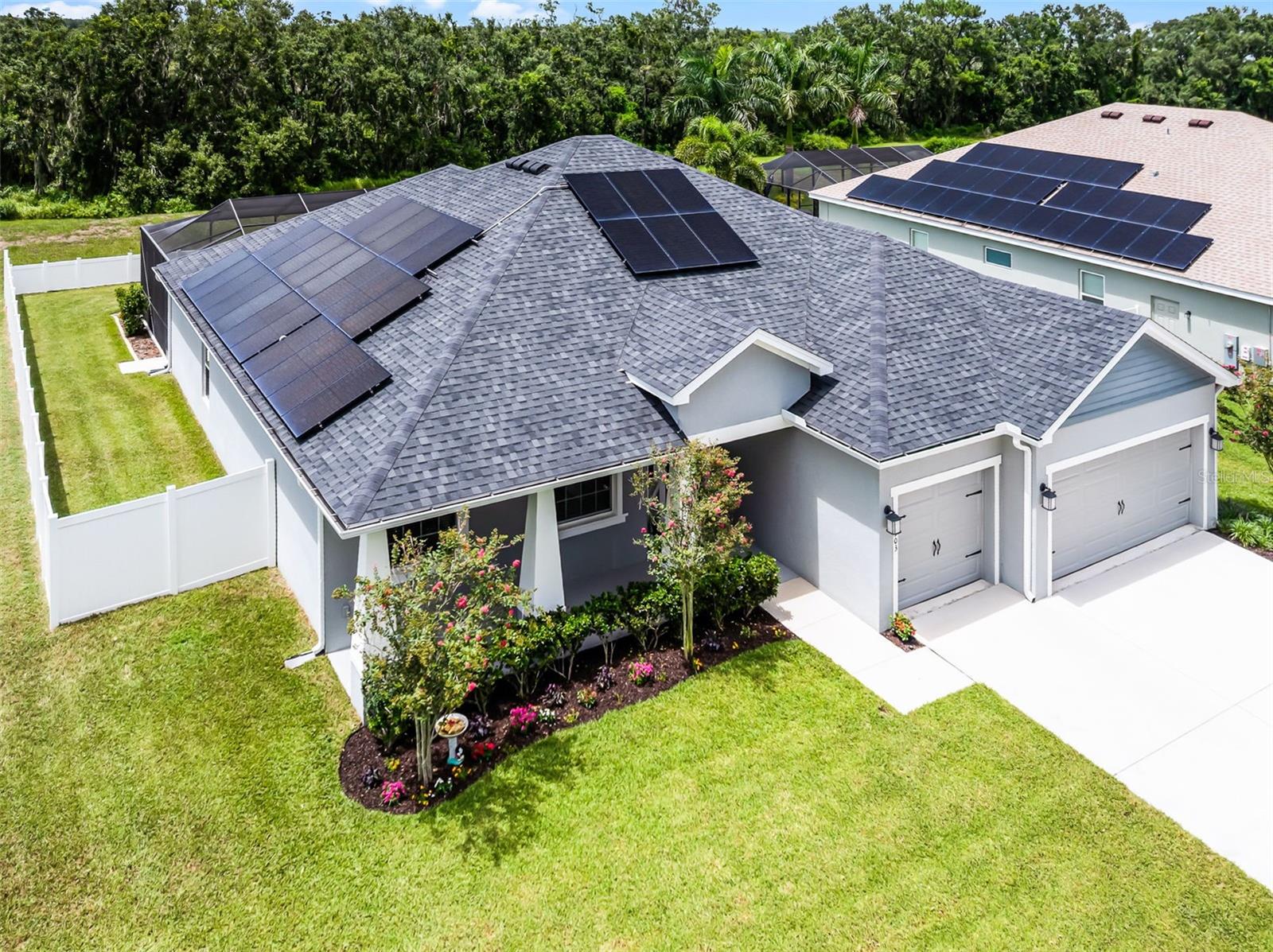 Welcome to this beautifully upgraded 4-bedroom, 3-bath home in the highly desirable gated community of Juliana Village. Tucked away from the main road on a .24-acre lot with no rear neighbors, this property offers added privacy and tranquility. Outdoor living features a fenced backyard, screened lanai, heated saltwater pool, and hot tub with built-in table and bench seating, waterfall feature, and convenient access to a full pool bath. Inside, the split-bedroom floor plan opens into a spacious living room and kitchen combo featuring a large island, granite countertops, tall upper cabinets, soft-close doors, a walk-in pantry, and stainless steel appliances. The utility room offers additional storage with added cabinetry, along with ceiling-mounted storage in the 3-car garage. The home also features solar panels and is pre-wired for a generator, providing energy efficiency and peace of mind. Conveniently located just minutes from I-4, Publix, and new shopping and dining options.