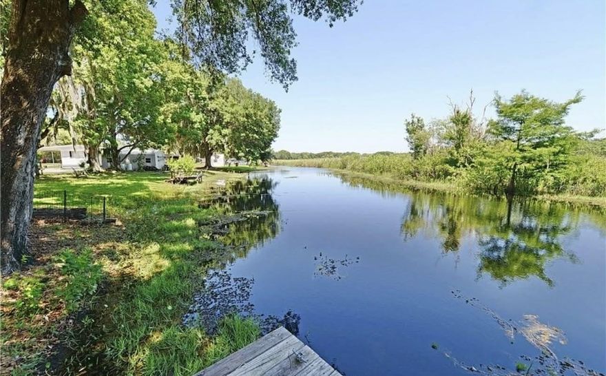Nestled along the tranquil shores of Lake Henderson in beautiful Inverness, Florida, this fully renovated single-wide mobile home offers the perfect blend of modern comfort and peaceful waterfront living. Featuring 2 spacious bedrooms and 2 updated bathrooms, this home has been thoughtfully redesigned from top to bottom with high-end finishes and contemporary style.

Step inside to an open, light-filled layout where the living and kitchen areas flow seamlessly together. New windows and a sliding glass door flood the space with natural light while showcasing serene lake views. The modern kitchen and living space create an inviting atmosphere ideal for relaxing or entertaining.

Both bedrooms provide cozy, private retreats, perfect for unwinding after a day on the water. Outside, enjoy the stunning surroundings from the 200-square-foot deck overlooking the lake canal — an ideal spot for morning coffee, evening sunsets, or outdoor dining.

This home has undergone a complete renovation inside and out, including a new roof, HVAC system, water heater, windows, flooring, electrical breaker box, cabinetry, water conditioning system, bathrooms, and more — truly move-in ready with peace of mind.

The newly updated exterior siding enhances curb appeal while adding long-lasting durability. Whether you’re searching for a weekend getaway, investment opportunity, or full-time waterfront residence, this lakeside gem delivers comfort, style, and unbeatable views in the heart of Inverness.