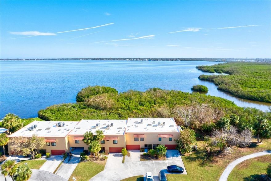 This immaculate, turn-key furnished condo boasts BREATHTAKING views of Palma Sola Bay! Discover your coastal oasis just 3 miles from the beautiful beaches of Anna Maria Island. When you enter the home on the ground floor, you are greeted with an oversized - non-conforming great room with it own seperate HVAC!  Perfect for game room, man cave, or additional living space! Did I mention an OVERSIZED 2 car garage with workbench and shelving?  Upstairs, prepare to be wowed!  Enjoy beautiful sunrises and bay views from your living room or from the screened porch off the updated kitchen, where you can enjoyn having your morning coffee or winding down in the evening with a glass of your favorite vino.The spacious master bedroom features walk in closet, an office space - ideal for remote work, along with a luxurious master bathroom featuring dual sinks and an oversized shower for ultimate relaxation. Both the upstairs and downstairs HVAC units were replaced in 2024, ensuring comfort year-round. Also, hurricane-impact windows and sliding doors have been installed throughout the unit which is great for keeping insurance costs low!  In total, Unit has had $150,000 of renovations and is immaculate!   For water lovers, kayaking access is conveniently located behind the unit, making it easy to explore the serene waters of Palma Sola Bay.  The community features a spacious clubhouse, game room, library, gym, 2 heated pools and much more.  Your condo fee of just $675/mth includes cable, internet, sewer, trash and flood insurance.   Don’t miss this opportunity to own a slice of paradise!