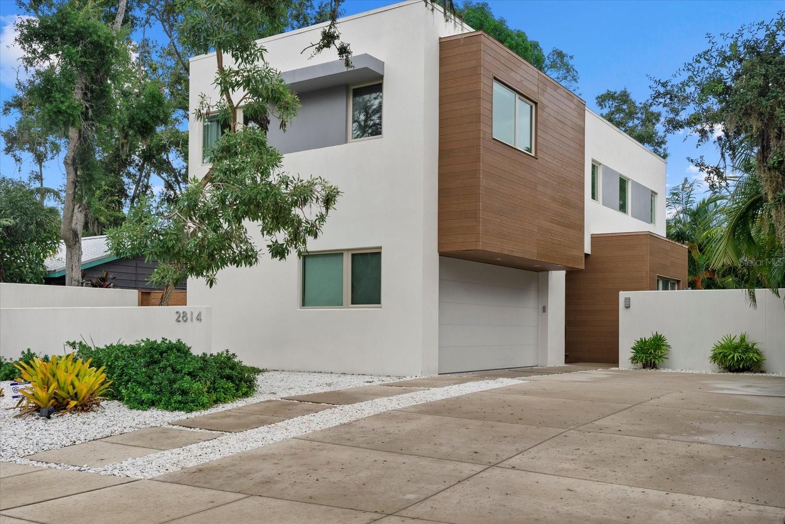 The Circle House – a modern sanctuary in the heart of historic Sarasota. Tucked in the storied charm of Sarasota’s Indian Beach/Sapphire Shores, The Circle House offers an extraordinary blend of modern design, sustainable living and timeless location. Masterfully crafted in 2017 by Lunardi Architecture, this private urban retreat reflects a European sensibility infused with Florida light and style. Set just minutes from downtown Sarasota and SRQ Airport, and mere steps from the Ringling College of Art and Design, this architecturally significant home captures the essence of convenience and creativity. Walk just three blocks to the edge of Sarasota Bay to savor tranquil sunsets in a neighborhood steeped in culture and history. Featured in SRQ Magazine’s “Best of SRQ,” the home’s design prioritizes clean lines, soaring transom-lit windows, and a thoughtful indoor-outdoor connection. At its heart, an open-concept main level seamlessly integrates the kitchen, dining and living areas, ideal for effortless entertaining and relaxed daily living. Quartz waterfall countertops, Energy Star appliances, sleek cabinetry, and birchwood and tile flooring elevate the home’s sophisticated yet inviting ambiance. The second level includes three spacious bedrooms and two luxury-appointed baths, with a cozy book nook and convenient upstairs laundry tucked thoughtfully into the floorplan. Framed by verdant landscaping, the private courtyard oasis features a saltwater pool and spa and ample space for alfresco gatherings. Sustainability meets serenity with Gold LEED certification, achieved through impact-rated windows, hybrid electric water heater, high-efficiency HVAC systems, and eco-conscious materials from siding to plumbing. A two-car garage and generous storage options round out the residence. In walking distance to A-rated Bay Haven Elementary and central to Sarasota’s finest dining, arts and beaches, this is not just a home, it’s a modern masterpiece crafted for inspired living.