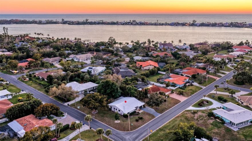 PRICE REDUCTION! Stunningly Beautiful TURNKEY FULLY FURNISHED Coastal Retreat in the Sorrento South Boating Community of Nokomis featuring 3 Lovely Bedrooms and 2 Bathrooms. NO FLOOD DAMAGE from recent storms. Northern views feature the harbor with 42 boat slips directly across from the property. This thoughtfully modernized mid-century modern home has been tastefully renovated in 2022 from top to bottom showcasing natural earthy coastal lovely finishes, fresh paint, lighting, Hickory Lux Vinyl Plank flooring throughout to a chef's dream kitchen with Frigidaire Gallery appliances, a Fabulous Fantasy Brown Leather Granite Island with 4 bar stools & matching flowing countertops including sizable coffee bar. The Master Bedroom Ensuite offers a King Size Bed with tasteful furnishings, TV, aesthetically pleasing full bathroom with separate vanity area, large walk-in closet and privacy sliders which lead to the Florida Room. The Second Bedroom also provides a King Size Bed, stylish yet functional pieces, TV and large walk-in closet. Bedroom 3 has Double Bunkbeds embellished in a child friendly Coastal theme, TV and large walk-in closet. This impressive layout features an open concept minimalist design connecting the Living Room, Dining Room and Kitchen Area which flows to the wonderfully appointed Florida Room, boasting painted wood beams, built-ins, TV, a sparkling freshly polished Terrazzo floor & sliders. The Florida Room is also perfect for relaxing or entertaining and has expansive views of the lanai and parklike backyard. Enjoy your morning coffee or nightly favorite beverage amidst the serene treed .38 oversized lot with gorgeous views of your majestic Banyan from your own private enclosed spacious lanai.
In addition, the oversized Laundry Room adds so much more bonus space equipped with a washer, dryer & utility sink, Built-ins & a clever creative chalkboard utility closet. 2nd Refrigerator in the garage. Storage shed on the West side of the property.
For Peace of Mind All New Impact Windows are in place for any inclement weather & a Home Warranty through American Home Shield will be offered.
The upgrades are too numerous to mention and can only be appreciated by viewing in person. Seeing is believing! Set up your private showing today and start living the Fantastic SW Florida lifestyle in Sorrento South.
Nokomis, Venice and World-Renowned Siesta Key beaches are all within a short drive.
Centrally located between Sarasota & Venice-you'll have plenty of choices of shopping, dining and activities with easy freeway access.