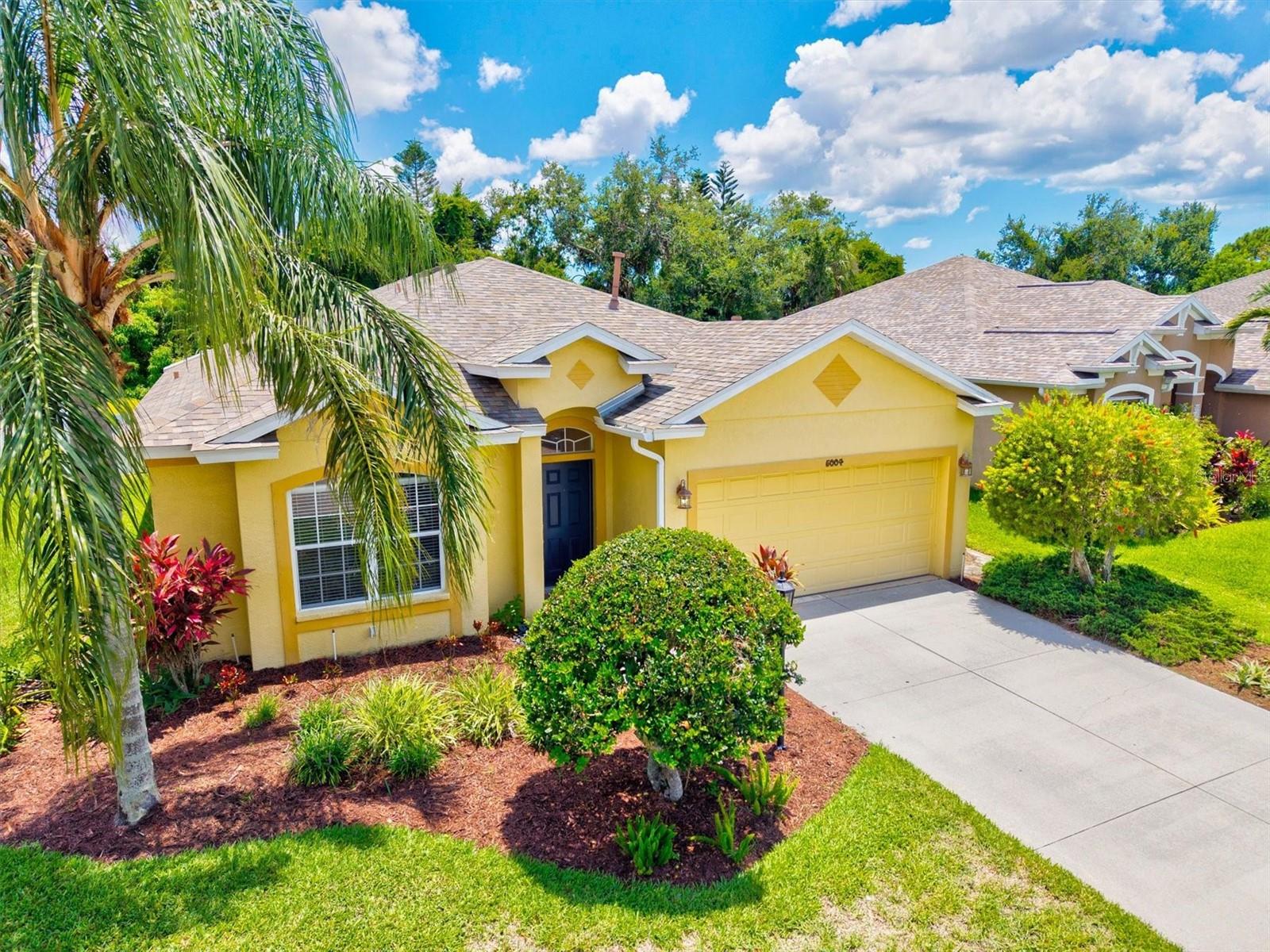 Simply spectacular... you will love this spacious, light, bright remodeled home in beautiful Carlyle at the Villages of Palm Aire, a community that is surrounded by mature, tropical landscaping. This flowing floorplan offers 3 bedrooms, 2 bathrooms, formal dining room and two living spaces, one with a cozy fireplace. The gourmet kitchen offers a sprawling island with gorgeous Quartz counter tops and stainless-steel appliances... gas is available in this community. This property offers a wonderful salt water pool, built in 2015, that is completely fenced and has the drop back of lush, tropical trees. Relax poolside in the private, peaceful screened lanai and enjoy watching the birds and feeling the warm Florida sun while sipping your morning coffee or evening cocktail. This house also has a young roof (2020), newer AC (2024) and a tankless gas hot water heater. You will love the lifestyle that this Southwest Florida home offers. The home has been meticulously maintained with beautiful finishes including brand new flooring throughout... hard flooring through the main living areas and fresh carpet in the bedrooms... this home is ready for you to add your own personal touches. This community sits close to a gorgeous golf course and a membership at the Palm Aire Country Club is optional...create the Florida lifestyle that you choose. This home is conveniently located near I75, downtown Sarasota, UTC Mall, Benderson Park, Sarasota Airport, various shopping and multiple restaurants. This home is also only a short drive from award winning Gulf Beaches... what a convenient location and a wonderful lifestyle to live! Come see, come sigh... come and make this home your own.
