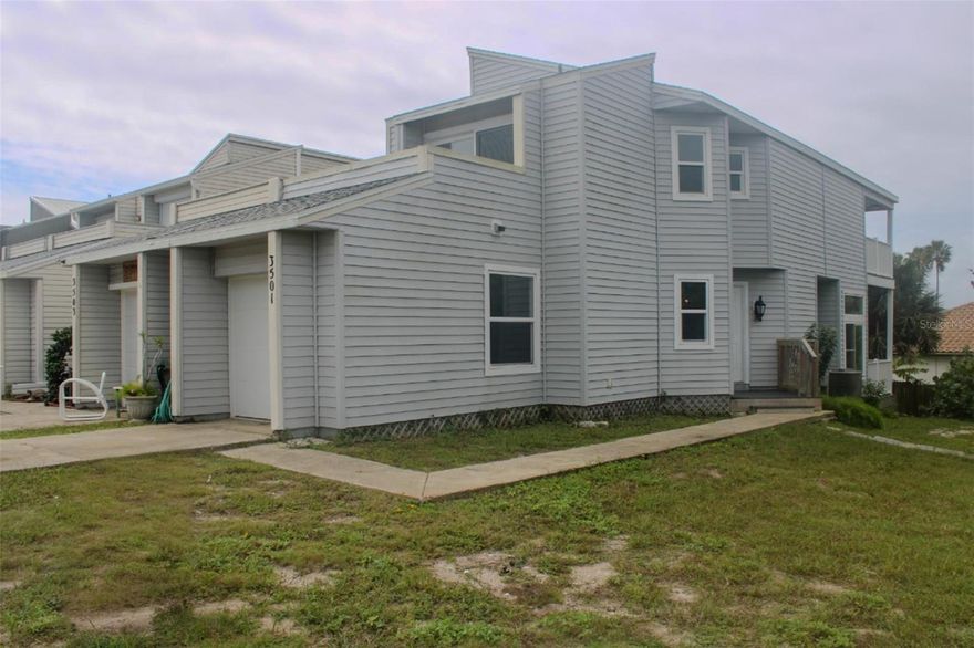 THIS PROPERTY HAS A SHORT-TERM LICENSE !!!!!!!!Welcome to Flagler Beach Florida!  With Views of the GOLF COURSE, AND THE OCEAN, Great location, with no HOA, Introducing this beautiful townhouse with 2-bedroom 2,5 bath home with 1 car garage. offers a blend of modern amenities and stylish design. From the second-floor balcony, you can enjoy ocean views. and in the rear of the house direct access to nine-hole golf course and view and the intracoastal. Master bathroom complete with a separate sink area enhancing convenience and privacy. Freshly Painted, All new Appliances, all bedrooms are well-sized, ideal for family members or guests. with 2 Skylights throughout the home brings natural light. NEW flooring has been recently upgraded to Laminate; For those cozy nights the fireplace will keep you warm. Additional features include NEW hurricane impact windows for a safety 2024, NEW Roof 2024 and newly Water Heater. New Garage Door and Opener, YOU WILL LOVE EVERYTHING ABOUT THIS HOME!!! YOU MUST SEE IT!!! Don't miss the opportunity to live in Flagler Beach (WALKING DISTANCE TO THE BEACH). Not far from restaurants, shopping, schools, and medical facilities! Quick access to I95 or US1 to travel North to St Augustine or South to Volusia County. READY TO MOVE RIGHT IN!!! WALKING DISTINCE TO THE BEACH!!