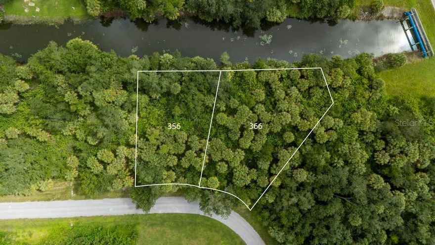 Two vacant parcels being sold together as a package for a combined total of approximately 0.60 acres on a canal in desirable Port Charlotte. This oversized site is the perfect setting to build your Florida dream home, offering water views, canal access, and the opportunity to fish right from your backyard. Enjoy beautiful morning sunrises from the rear of the property with cooler shaded afternoons. Convenient to US-41, I-75, shopping, restaurants, schools, and Gulf beaches. Public utilities not currently available—well and septic required. Seller will not sell parcels separately.