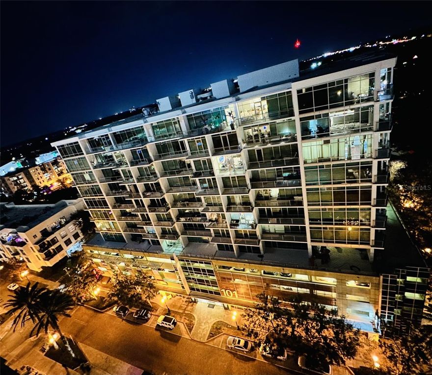 Welcome to Jr. Penthouse 1115 at 101 Eola...  where elevated city living meets effortless style in the heart of Downtown Orlando.

Perched high above the vibrant streets of the South Eola-Thornton Park district, this junior penthouse delivers a sleek, modern aesthetic wrapped in dramatic floor-to-ceiling emerald glass, flooding the space with natural light and showcasing stunning skyline views. Step outside onto your private oversized balcony, the perfect setting for morning coffee, evening wine, or simply taking in the pulse of the city below.

Inside, expect a clean, contemporary design with high-end finishes, including stainless steel appliances, stone countertops, and a blend of tile and wood flooring that creates a polished, urban feel. Whether you're entertaining or unwinding, this space is designed to impress without sacrificing comfort.

Living at 101 Eola means stepping into a lifestyle—not just a home. Residents enjoy access to resort-style amenities, including a 5th-floor pool deck, sunken spa, sauna, and 24-hour fitness center, along with concierge services and secured parking (including your dedicated space).

Step outside and you’re instantly immersed in one of Orlando’s most walkable and stylish neighborhoods lined with boutique cafés, craft coffee spots, juice bars, and curated dining experiences. You’re also just moments from the iconic Lake Eola Park and everyday essentials like Publix Urban Market.

Jr. Penthouse 1115 isn’t just a residence... IT's a statement. A rare opportunity to own a piece of one of Downtown Orlando’s most architecturally distinctive buildings, perfectly positioned for those who want luxury, walkability, and a true urban edge.