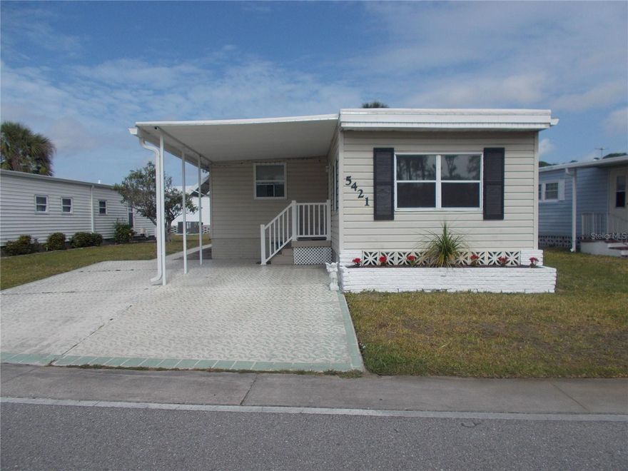 JUST REDUCED!!! This is a 2 Bedroom, 1 Bath home, not in the Pet Section.  It is bigger than you think! You have a Living Room and a bump out (11 feet by 28 feet) that is used as the Dining Room and a Bonus Room which is off the Dining Room and has a door to the back. This gives you an additional 308 sq feet. Your primary bedroom is in the back of the house, and the bathroom has a shower. You have 2 parking pads in the front. The 10 X 25 shed has the washer and dryer. In Holiday Park you own the land with a deed and your $195.00 monthly maintenance fee ($2340.00 a year) is included in your taxes. The community features 2 clubhouses, 2 swimming pools, a library, a fitness room, tennis courts, pickleball & bocce courts, to name a few. You are close to shopping, dining, entertainment, numerous golf courses, sports facilities, and SW Florida's renowned beaches. Come take a look!