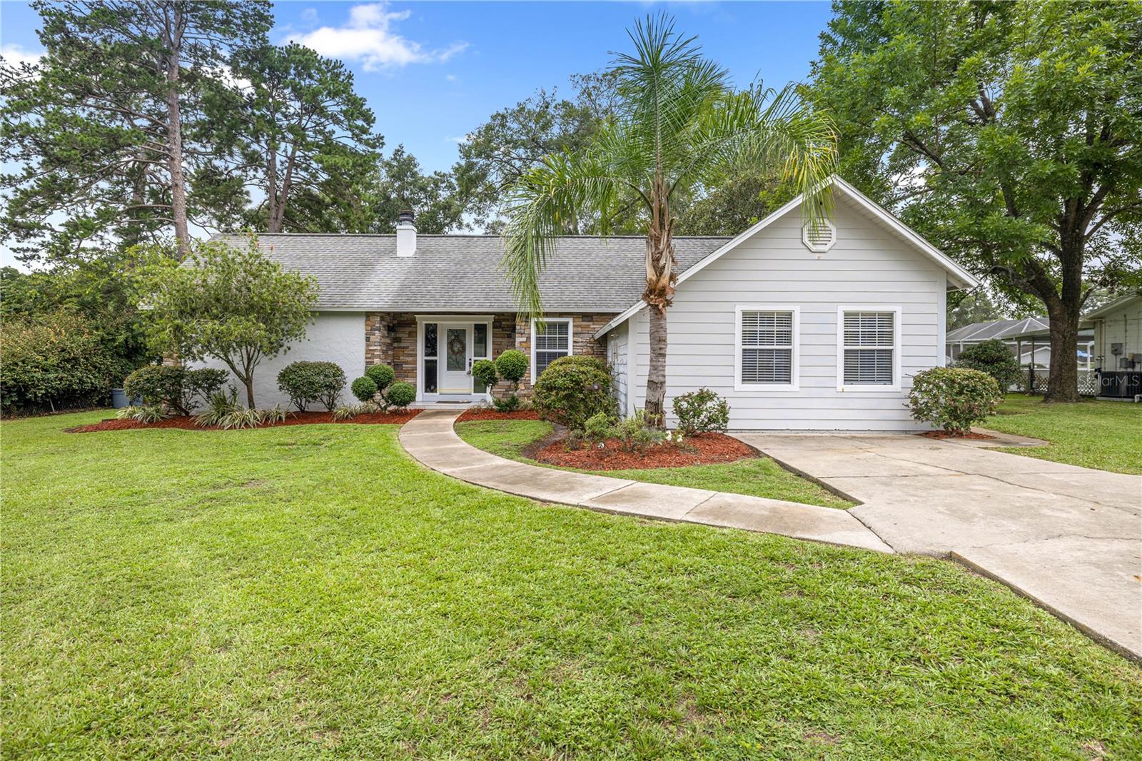 CHARMING THREE BEDROOM-TWO BATH HOME with Modern Updates and Cozy Fireplace - Nearly Half an Acre and priced to Sell!
Welcome to your new home! This spacious 3-bedroom, 2-bath residence offers nearly 1,800 square feet of comfortable, air-conditioned living space, perfectly situated on almost half an acre of land. This beautiful home combines space, style and convenience all nestled in the perfect location close to shopping, dining, and everything you need actually within walking distance or bring the golf cart! This home combines modern comfort with everyday practicality. Step inside to a nicely updated kitchen featuring wood cabinetry, granite countertops, and sleek stainless steel appliances – a dream space for cooking and entertaining. The layout flows easily into the living and dining areas, making this home perfect for gatherings and everyday living along with a lovely wood-burning fireplace that is just right for the cozy settings and relaxing evenings. The primary suite includes a private bath, while two additional bedrooms offer plenty of room for family, guests, or a home office. Outside, enjoy the expansive fenced backyard – ideal for gardening, play, or future outdoor projects. Other highlights include an HVAC system replaced approximately 5 years ago for peace of mind and a roof that, while still in working condition, the home is attractively priced to reflect its age. This home is a great opportunity for buyers looking for value, space and a move-in ready property in a prime location.
Don't miss this opportunity to own a well-maintained home with room to grow – schedule your showing appointment today!