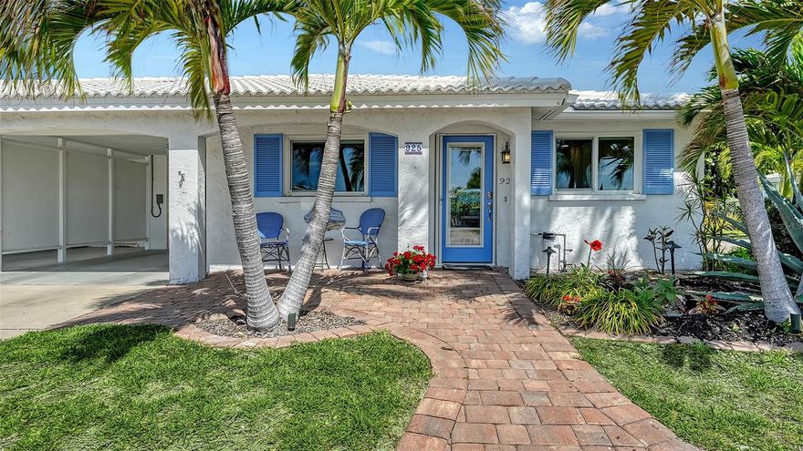 Wow! Panoramic water views from almost every window, plus rare direct access to Bay waters just near the back paver patio. This completely renovated two-bedroom, two-bath, 1,449-square-foot home is a must see! Fully remodeled in 2025/2026 in full compliance with FEMA requirements. It is all about details as this gorgeous Spanish Main turnkey furnished villa is ready to welcome you home! The centerpiece of the kitchen is the large, strategically custom-designed quartz island that doubles as a dining table, in a soft color palette that can seat 10. The kitchen features beautiful all wood 42-inch cabinetry, stainless steel appliances, large undermount sink with a push-button garbage disposal, lovely backsplash and lots of storage with an abundance of additional counter space, ideally designed for entertaining. The villa flows seamlessly with an expansive open floor plan, plank tile flooring in every room plus crown molding that frames each room. The large primary bath has an oversized, classically designed walk-in shower created for handicap access with double sinks. The tastefully appointed guest bath has an all-glass enclosed walk-in shower. From guest bath, enter the 9-by-6-foot in villa laundry room with new Electrolux washer and dryer. All hurricane-grade windows and doors to secure the home from the Florida storms. Custom window shades provide sun mitigation and ultimate privacy. The fully enclosed glass Florida room is a treasure in and of itself with extensive views of Sarasota Bay, with a lush backdrop providing total privacy. There is also a built-in office space, large walk-in closet, additional flex space for dining and/or lounging plus a dry bar and wine center, which makes this a useful space. Go outside onto the brick paver patio and lounge, grill and relax with the sound and views of Bay waters and abundant bird and wildlife. Grab your kayak or paddleboard and launch right from the backyard with direct water access to the open Bay waters. This villa is packed with so many upgraded features with new tile roof in 2019, air conditioner in 2020 and tankless hot water in 2018. The villa is part of the Spanish Main Yacht Club community, which has some of the best waters to explore in Sarasota for fishing, sandbar enjoyment, kayaking and swimming right in your backyard. You have direct access to the Intracoastal Waterway and a quick boat ride to the Gulf of Mexico, with restaurants you can get to by boat. The Spanish Main maintenance-free community has a wonderful neighborhood feel with a heated pool overlooking the 40-slip marina, deeded beach access, with social events galore making every day feel like a vacation as you lounge in the sun and enjoy the sea breeze. Slips are available for affordable leasing. Beach access is ideal for those numerous beach days and magnificent sunsets. This pet-friendly very active 55-plus community are added benefits for your enjoyment. Only a short drive to the fantastic shops and restaurants including Anna Maria Island plus cultural events Sarasota and St. Armands Circle have to offer. Private second-deeded parking place with this villa.