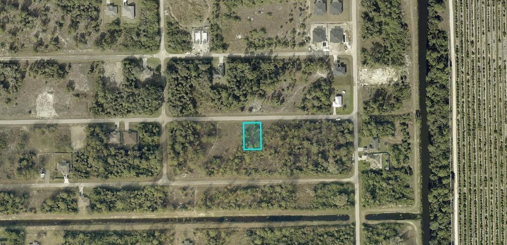 Photo of 806 Genoa Avenue S, Lehigh Acres, FL 33974 (MLS # A4691114)