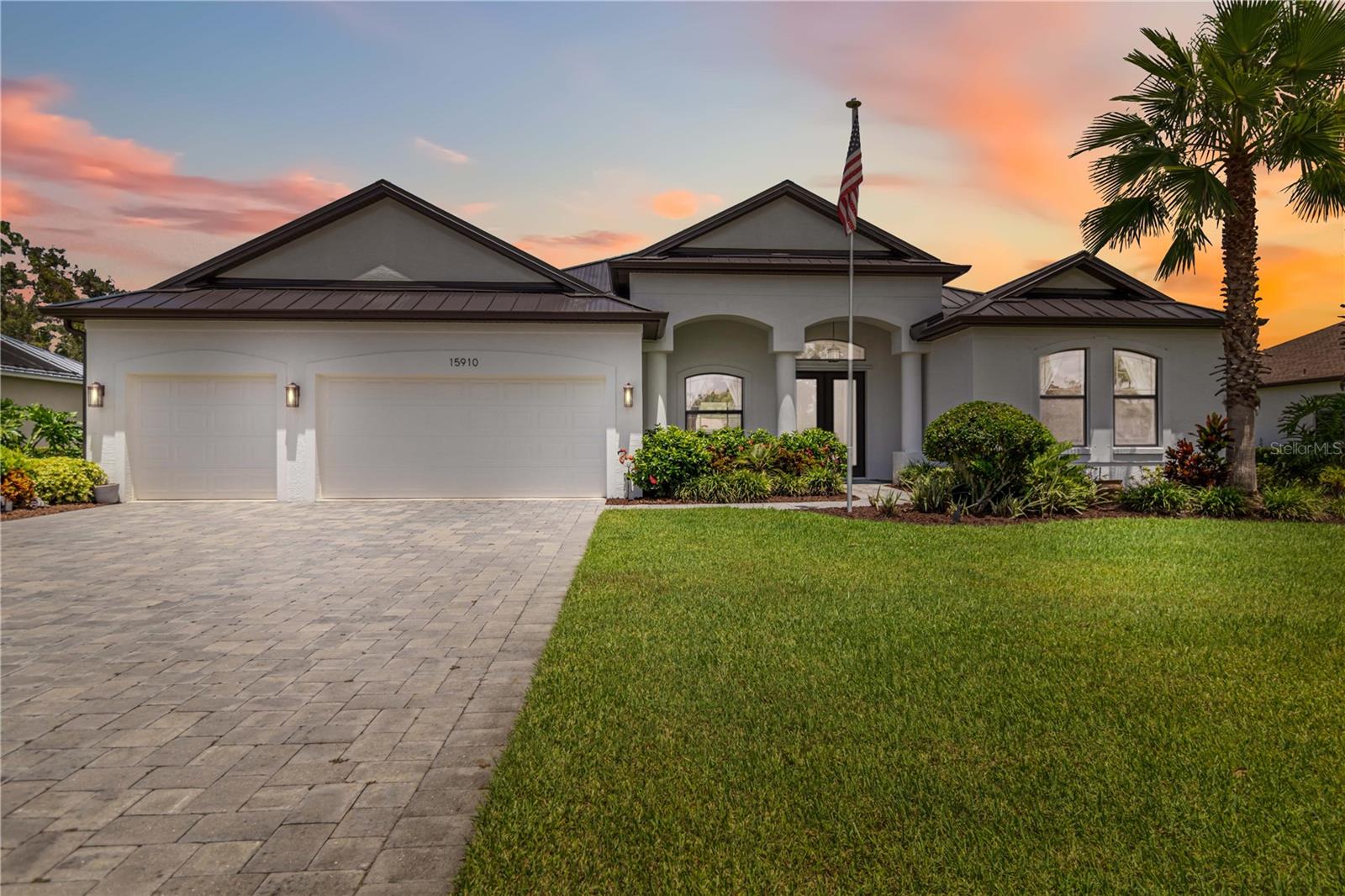 Sitting pretty on a ½-acre lot with peaceful pond and preserve views, this Medallion Aruba model is a neighborhood favorite—and it’s easy to see why. The thoughtful split floor plan creates a true retreat for the owner—an oversized office connects directly to the owner’s suite and spa-inspired bath, tucked away on one side of the home for privacy. On the other, two additional bedrooms and a full bath are perfect for guests, family, or hobbies.
At the heart of the home, the kitchen and living room flow seamlessly together, enhanced by luxury touches like coffered ceilings—and beautiful LVP flooring throughout with no carpet anywhere. The upgrades don’t stop there—enjoy a freshly painted exterior, brand-new 24-gauge standing seam dark bronze metal roof (installed May 2025), tongue-and-groove lanai ceiling, extended paver patio, fully fenced yard, solar-heated pool, and gutters—all thoughtfully added within the past two years. Plus—a generator hook-up on the main electrical panel for worry-free living during any Florida storm.
Twin Rivers is a standout Parrish community with expansive lot sizes, abundant green space, and direct access to the Manatee River. Residents enjoy community events like Food Truck Thursdays, an annual picnic, and plenty of neighbor-led activities—all with low HOA fees and no CDD.
This home is breathtaking inside and out, and it’s ready for its next owner. Schedule your private showing today!