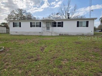 Nice 3 or 4 bedroom 2 BA double wide mobile with fireplace situated on a corner lot. New roof, New power pole w/surge protector.
Includes vacant lot behind it, that has water, electric and septic and its own address and parcel number.. lot with home is .24 and
vacant lot is .23. Fenced. Home needs TCL. Near Lake Bryant boat ramp. Lake Bryant has some good Bass fishing.
Bring 2 families/ 2 friends and enjoy.