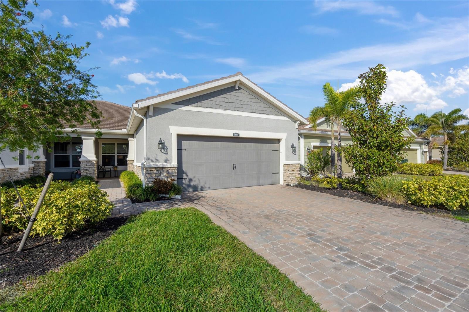 ***TURNKEY FURNISHED*** and beautiful views/sunsets! Casual elegance will greet you as you enter this one owner Villa, seasonally used, with a beautiful water view. This 2018 built 2BR/den/2BA Bayport model features an open concept floor plan and is offered ***TURNKEY FURNISHED*** (most furniture from Matter Bros). The beautiful kitchen with upgraded appliances, single bowl sink, large island, custom light fixtures, and walk in pantry is sure to please! Beautiful window treatments on all windows allow for privacy, while allowing natural light to come in. The great room is a central gathering area offering magnificent views, yet still close to the kitchen/dining area. Currently the den/study serves as a quiet retreat for reading/working/relaxing while watching TV, but could easily be used for overnight guests (3rd BR) as well. The guest bedroom is conveniently located at the front of the home with an adjoining bathroom. Primary bedroom is strategically located in the rear of the home with amazing water views. En suite bathroom features an upgraded frameless oversized shower with tile to ceiling, dual sinks, and a spacious walk in closet. Enjoy peaceful views and gorgeous sunsets from the screened lanai with wonderful Western Exposure. Sunrise Preserve at Palmer Ranch is an amenity filled, gated community that offers a spectacular 5000 s.f. clubhouse, a fully equipped fitness center, resort style "zero entry" pool, spa, 2 tennis courts, 2 Pickleball courts, 2 bocce courts, and grill/firepit areas. Lots of planned activities making meeting your neighbors easy and fun! In addition to ALL amenities, the monthly fee also includes the roof & exterior paint, exterior hazard insurance, as well as grounds maintenance/irrigation. Conveniently located just 2 miles to I75, 20 minutes to Siesta Key, and just minutes to shopping, nearby restaurants, and the Legacy Trail.