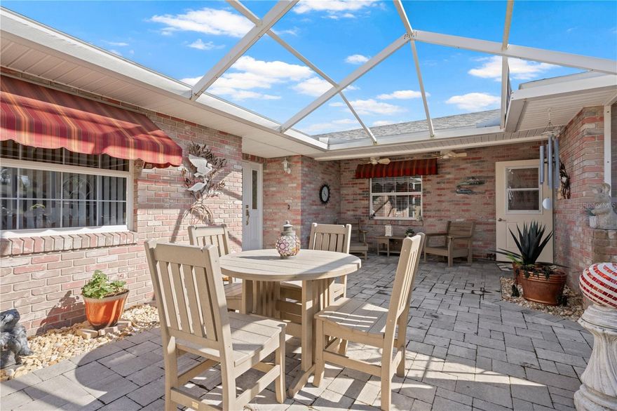 Now is your chance! Come and be a part of this active, Golf Course community and live in this beautifully maintained, updated home. Enjoy the peaceful screened courtyard with your cup of coffee, or watch the gorgeous Florida sunsets. The inside of the home has been lovingly kept up and updated. You won't want for space in this well thought out layout. Plenty of room for entertaining, or a quiet read alone. The garage has been set up for your perfect workspace or storage, whatever suits your needs. You have unlimited options with the screen garage door and a mini split that keeps everything cool when you need it! This golf course community is gated with a guard 24/7. Even if you don't golf, there will be something for you to do. Jr Olympic size pool, tennis courts, soon to be pickleball courts and a full service clubhouse with live music every weekend. Enjoy peace of mind knowing that the AC is less than a year old and the roof was replaced in 2022! Schedule your viewing today and welcome home!