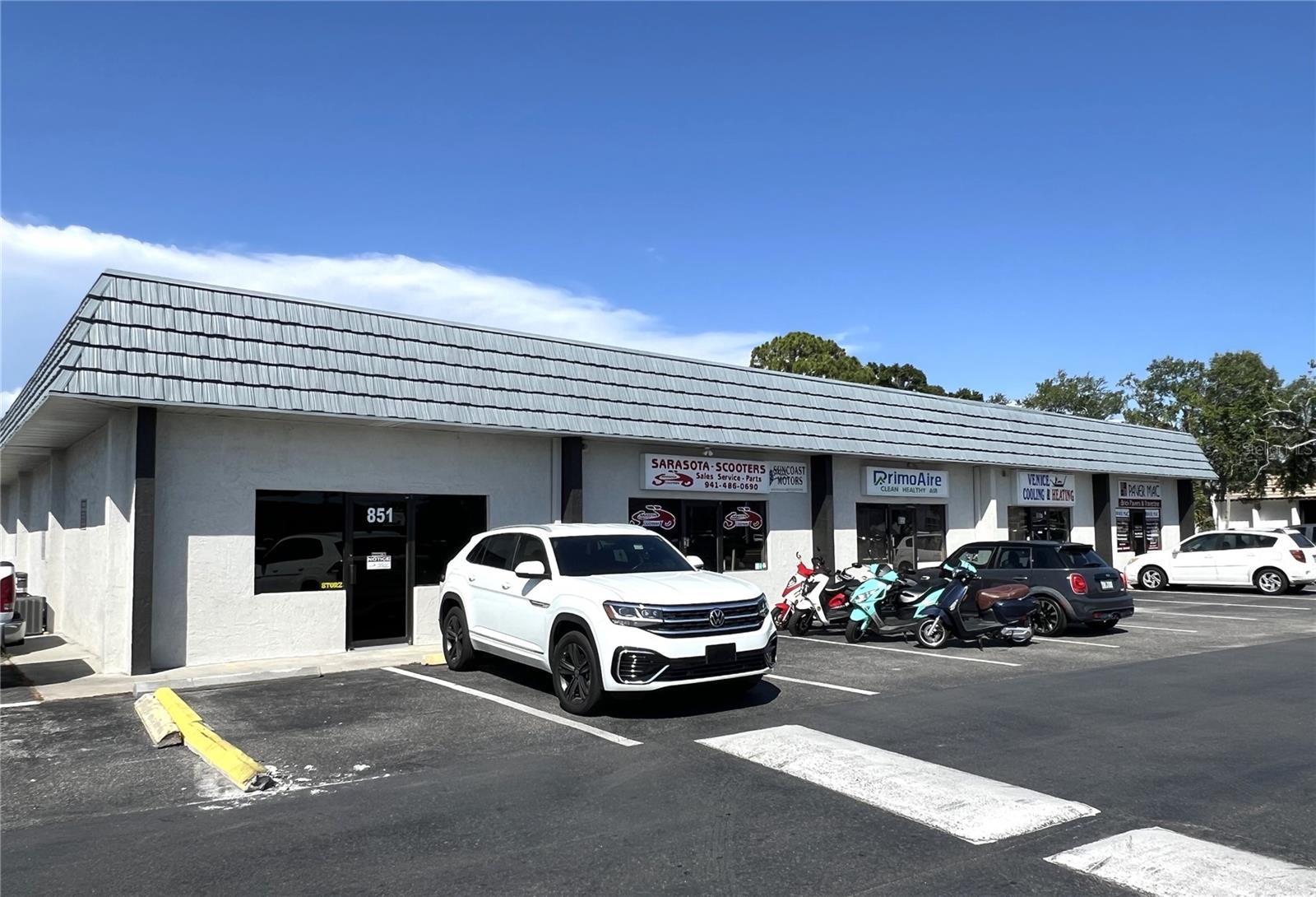 Don't miss your opportunity to purchase this 1,520 SF unit for sale in Venice!! This unit features a front retail area, office, 2 restrooms, and a storage area with a garage door in the rear of the unit. The unit will be vacant upon closing. CI (Commercial Intensive) zoning allows for many uses!
Average Annual Daily Traffic (AADT) count of 37,000! Current Association Dues : $2,650 per year per unit.
Business can be included in the sale for an additional cost: Sarasota Scooters Business! This great family-owned business - motor scooter sales, service, parts, and accessories!
New/Used/Wholesale motor vehicle dealership license.
Franchised dealer for several brands.