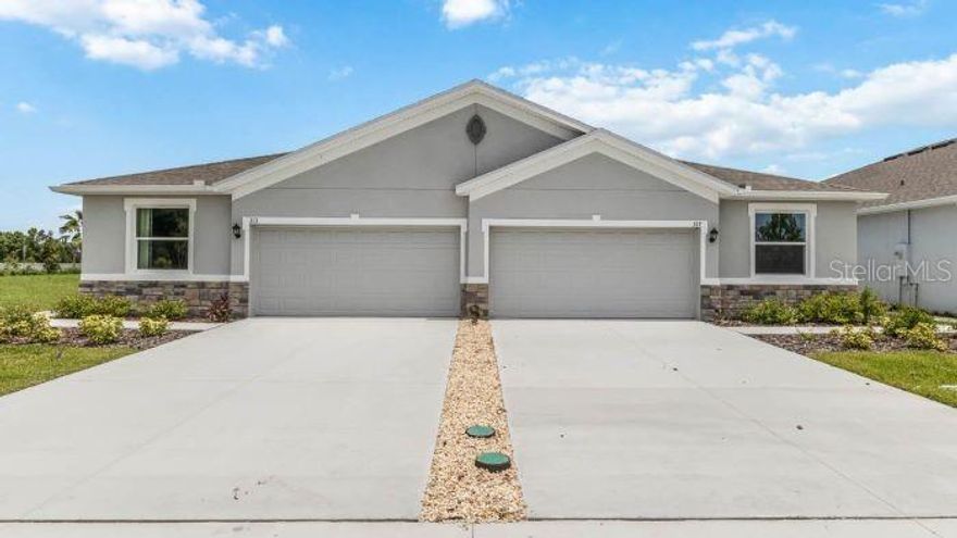 Under Construction. Receive up to $20,000 towards Flex Cash & Closing Costs + special interest rates with the use of our preferred lender - now through February 28th. This one-story, all concrete block constructed home has a truly open concept plan, featuring a spacious kitchen with a large quartz kitchen island that overlooks a large dining area, great room, and breakfast nook which flow out onto a covered lanai. The first phase of The Resort Club amenity center is NOW OPEN, including Trade Route Coffee Kitchen, Resort Style Pool, Fitness Center, Athletic Performance Center, and Pet Park. Future phases of The Resort Club will include a poolside bar & grill, outdoor activities area, The Event Center, and The Terrace Chef’s Patio. Future amenity centers, Adventure Retreat & Cabana Corner, will include Pickleball, Tennis & Bocce Courts, Pet Park, Golf Cart Parking, Sunset Terrace, Clubhouse, Resort Pool & Spa, Resistance Pool, Poolside Cabanas & Beach Area, Outdoor Activities Area, Poolside Grilling and more. This home comes with stainless steel dishwasher, range, and microwave. Pictures, photographs, colors, features, and sizes are for illustration purposes only and will vary from the homes as built. Home and community information including pricing, included features, terms, availability and amenities are subject to change and prior sale at any time without notice or obligation.