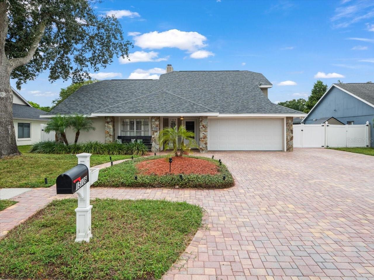 One or more photo(s) has been virtually staged. Beautiful 4-Bedroom Home with Scenic Pond Views
This spacious 4-bedroom, 2.5-bath home with over 2,100 sq. ft. offers a thoughtfully designed split floor plan with the Primary Suite conveniently located on the main level. The suite features dual walk-in closets and a spacious ensuite bath for added comfort. A large kitchen with breakfast bar opens seamlessly to the living areas, while the formal living and dining rooms—currently used as a theater and game room—are accented with elegant crown molding. The inviting family room is centered around a cozy wood-burning fireplace. Upstairs, three guest bedrooms provide plenty of space, two of which feature walk-in closets, and share a full guest bath. Step outside to a screened lanai designed for relaxation and entertaining, complete with an in-ground jacuzzi, outdoor grilling area with pergola, and serene pond views that create the perfect backdrop for stunning sunsets. An oversized brick paver driveway enhances the curb appeal and provides ample parking. Additional highlights include a brand-new roof (2025) and an unbeatable location just minutes from highways, Citrus Park, dining, and shopping. A true blend of comfort, style, and convenience—this home is move-in ready and waiting for its next owners.