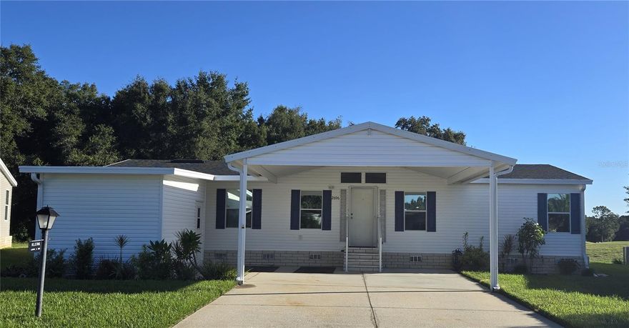 Zellwood Station Very well maintained 3-Bedroom 2 bath Palm Harbor manufactured home, triple wide! If the kitchen is the heart of your home, this is the home for you! Beautifully renovated kitchen, large open floorplan, laundry room. Split floorplan with large primary en-suite bedroom with HUGE walk-in closet! Custom window coverings throughout the house. Green space views of trees and the golf course from the enclosed patio. This house has everything you could want in a home and MOVE IN READY! Zellwood Station is a Resident Owned 55+ Golfing Community located between Apopka and Mt Dora.  We have a 72 Par golf course, 4 pools, pickleball and tennis courts; water exercise and line dancing classes and our own Whistle Stop Restaurant and Lounge with banquet facilities.  There is always something to do here.  Close to the 429 for easy access to airports and attractions, we are close to shopping, restaurants, medical facilities and churches.  Come and see what we have to offer!