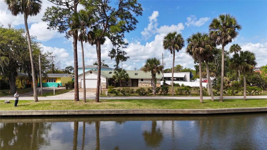 One or more photo(s) has been virtually staged. Enjoy a daily canal view from the front of the home while having the space and functionality you need—this 3-bedroom, 2.5-bath property offers 1,728 square feet of living space, multiple outdoor living areas, and a convenient Port Orange location.

The home features a functional layout designed for everyday living, with three full bedrooms, two full bathrooms, and a half bath to provide added flexibility. A large enclosed back porch expands your living space, while the screened-in porch offers a comfortable setting to enjoy the outdoors year-round.

The fenced-in yard adds privacy and usability, complemented by a separate storage shed for tools, equipment, or hobbies. A 2-car garage and spacious lot further enhance the practicality of the property.

Located in an established Port Orange area, this home offers easy access to nearby parks, shopping, dining, and major roadways. The setting provides a coastal feel with the added benefit of a canal view, all while maintaining the convenience of a residential neighborhood.

Whether you're looking for a primary residence, seasonal home, or investment opportunity, this property delivers a strong combination of space, functionality, outdoor living, and location.