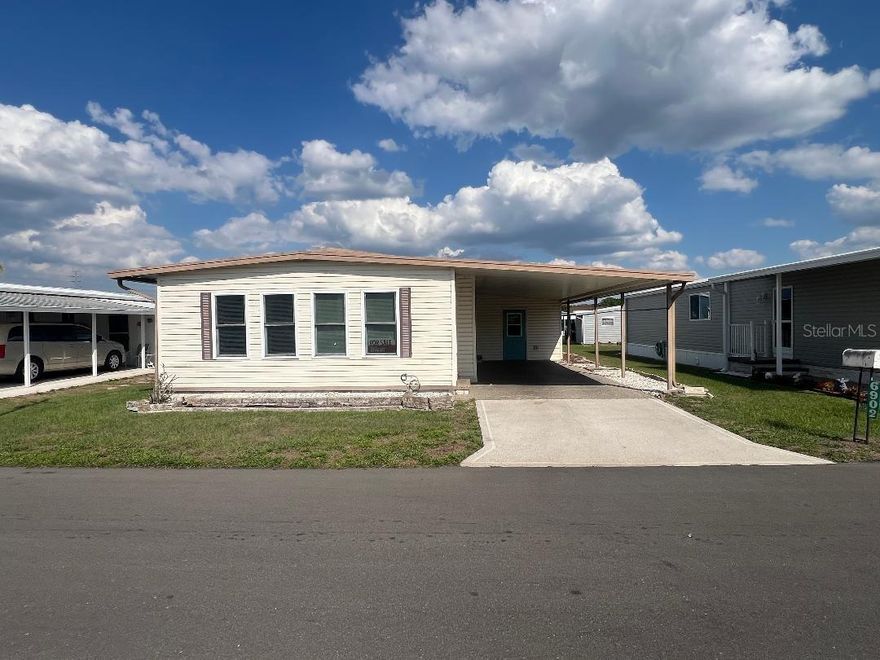 Enjoy affordable Florida living in this 2-bedroom, 2-bath doublewide manufactured home located in the gated 55+ community of Valleydale in Zephyrhills. This property includes owned land and comes furnished, offering a convenient move-in opportunity. Ideally situated near shopping, dining, and everyday conveniences, the location supports an easy, low-maintenance lifestyle.
The home features a desirable split-bedroom floor plan designed for added privacy. The guest bedroom and full bath are positioned at the front, while the primary suite is located at the rear and offers space for a king-size bed, vaulted ceilings, and an oversized closet, along with a private en-suite bath.
Interior living areas include a formal living room, dedicated dining space, and a Florida room that can serve as a secondary living or family area. Additional functional space includes a laundry/utility area and an approximate 14x10 workshop, suitable for hobbies or storage. Flooring consists of a combination of laminate and carpet throughout.
Exterior features include a covered carport with space for two small vehicles, along with nearby guest parking. Community amenities include a clubhouse, pool, shuffleboard courts, and walking areas.
This property presents an opportunity for comfortable living in a well-established community with convenient access to local amenities. Call us to schedule a viewing!