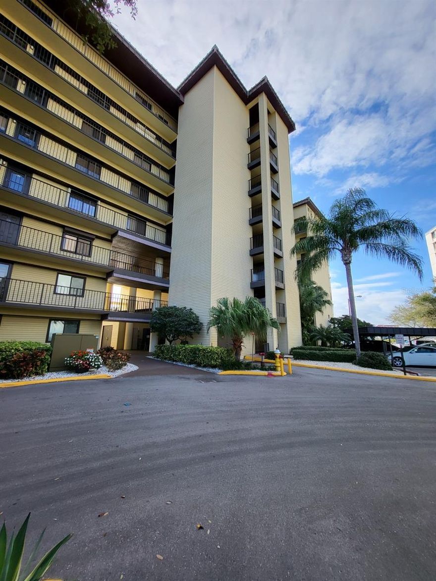 One or more photo(s) has been virtually staged. SPECTACULAR 270 Degree WATER VIEW - END UNIT that offers peaceful views of water. Ready for occupancy mid-January when renovation will be complete. Condo has ALL NEW HURRICANE RATED WINDOWS AND SLIDERS.  Enjoy SUNSETS & SUNRISES from your covered balcony. Be the first to enjoy the updates of this open floor plan that offers great space -Livingroom/diningroom combo and a separate room off the kitchen for dining or use as a den/office area. Luxury Vinyl plank floors throughout for easy maintenance and comfort.  Split bedroom plan. Primary bedroom has intercoastal views with SLIDERS to the balcony. Includes ensuite bathroom with shower and commode; separate sink area.  Walk in closet.  2nd Bedroom is spacious and has access to the main bathroom.  Washer and dryer closet inside the unit. Ceiling fans throughout. This unit offers a 270-degree view!! Has assigned Covered parking #, heated pool, tiki hut and BBQ grills for your everyday enjoyment.Min lease period is 7 months.  First month & security deposit and renter's insurance policy required. Have a preview of this for your next rental. updated pictures showing open plan with newer kitchen, will be provided of kitchen and new windows once completed. Great opportunity for waterfront living with many benefits of Island Estates; restaurants, Publix and more, only 1 mile from Clearwater Beach with quick access to the mainland.