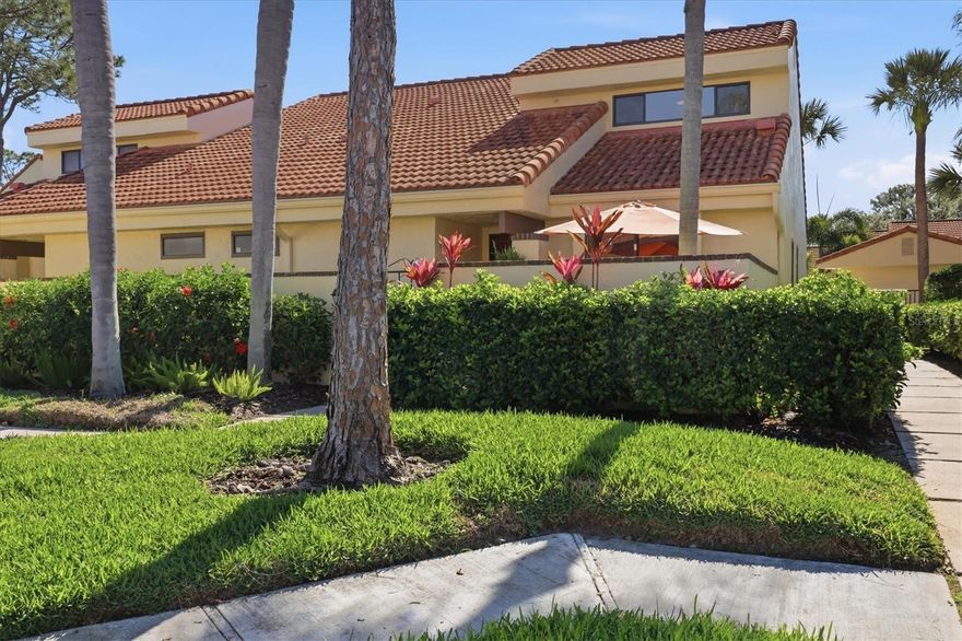 Beautifully Renovated 3BR Villa – Private Tropical Setting – Experience The Meadows Lifestyle. This is your opportunity to own a beautifully updated 3-bedroom, 2-bath villa-style condo in Huntingwood, a charming enclave within The Meadows—one of Sarasota’s most sought-after communities. Enter through a wrought iron gate to a private front courtyard patio, perfect for morning coffee or relaxing evenings outdoors. Completely renovated in 2024 with high-end style and flair, this home features an spacious open and airy living area with vaulted ceilings, large tile floors, abundant windows, and sliders that bring in natural light and tranquil greenery views. The kitchen has been opened to the living space and offers contemporary cabinetry, quartz countertops, European appliances, and a glass slider to the front courtyard for easy indoor-outdoor living. The first-floor primary suite features a beautifully updated en suite bath with double sinks, quartz counters, designer lighting, new fixtures, and a spacious walk-in shower with rain shower head and stunning tile. The primary bedroom opens to a peaceful Florida room with walls of glass overlooking tropical greenery, creating a private, Zen-like retreat. Upstairs are two additional bedrooms and another beautifully updated bathroom, along with luxury vinyl flooring throughout the second level. A large walk-in attic provides the added bonus of excellent storage space rarely found in condo living. This unit also has a carport with storage room just outside the front door. Living in The Meadows offers more than just a beautiful home—it’s a lifestyle, with miles of scenic walking and biking trails, mature landscaping, golf, tennis, pickleball, and fitness center in a prime Sarasota location close to shopping, dining, and world-renowned beaches.