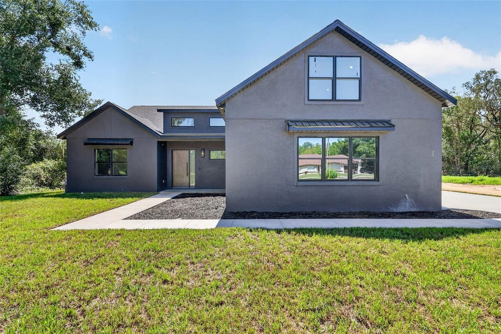 Photo of 60 Guava Pass, Ocklawaha, FL 32179 (MLS # G5117248)