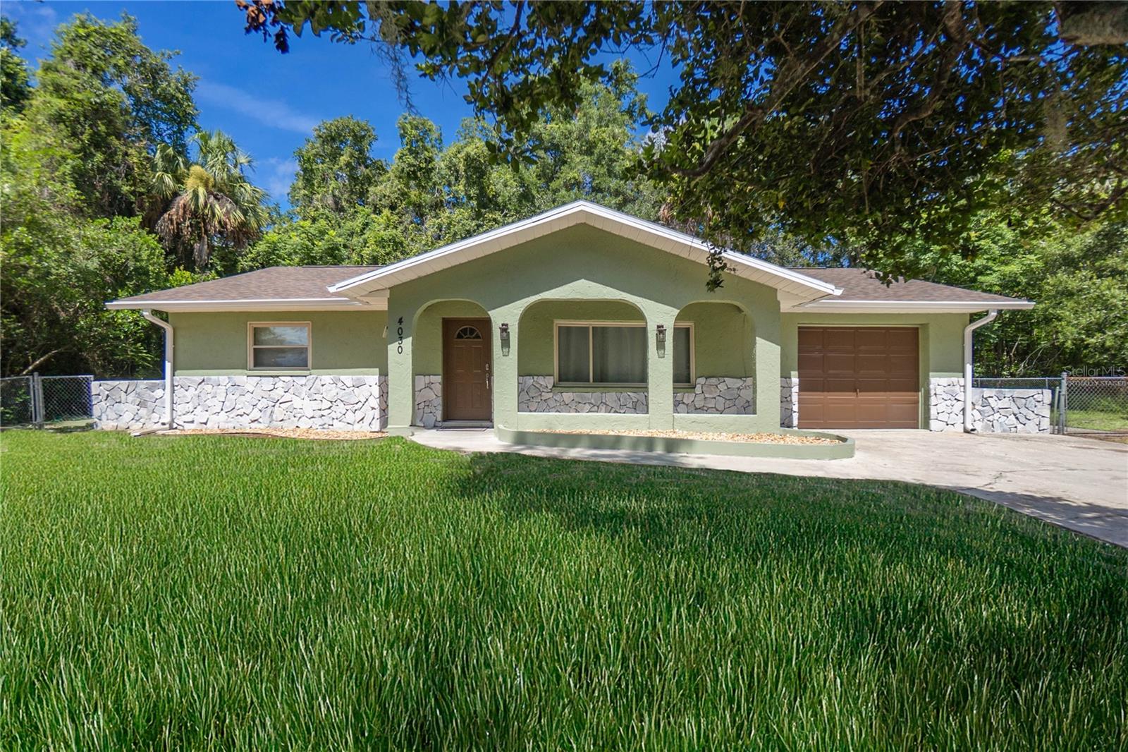 Instant income potential with this turnkey Airbnb opportunity in beautiful Crystal River! This fully remodeled 3-bedroom, 2-bath, 1-car garage home offers 1,803 of living and was built in 1979. The interior boasts wood-look tile flooring throughout, fresh interior paint, a split floor plan, and a stylishly updated kitchen featuring quartz countertops, wood cabinetry, and modern appliances. Additional upgrades include new interior doors, updated lighting and switches, waterproofed drywall (1.5' up), mold resistant insulation throughout, and thoughtful decorator finishes. Outdoor features include a fenced backyard, front covered porch, open patio, gutters, and a new roof installed in 2024. The septic system and drainfield are also new, and the HVAC system was updated in 2021. This property is sold fully furnished—including bikes and kayaks—making it a seamless transition for a vacation rental or personal use. Existing bookings may be transferred to the Buyer if desired. Don’t miss this exceptional opportunity in one of Florida’s most desirable coastal communities!