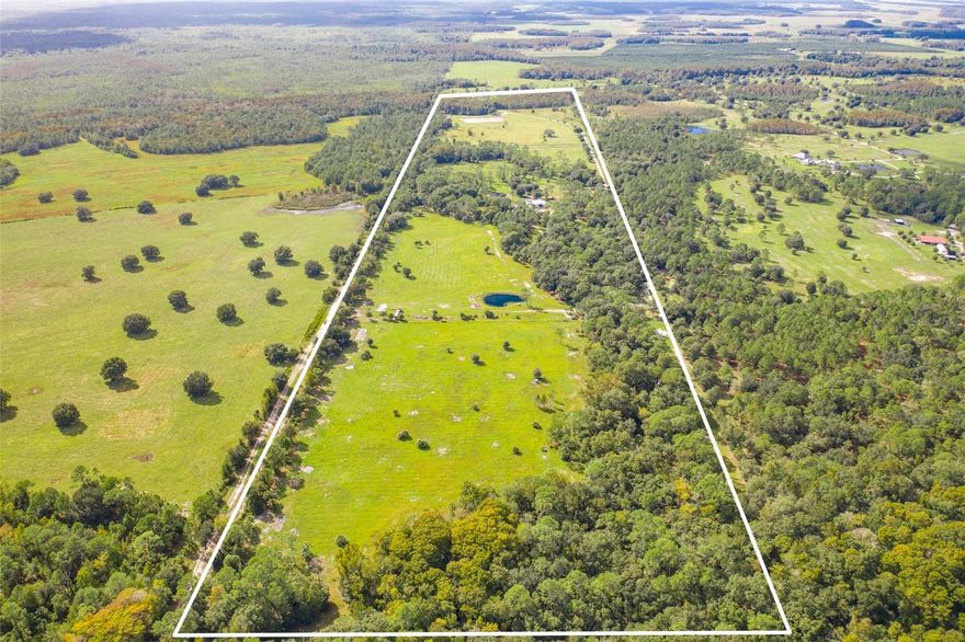 103 +/- Acre HOMESTEAD! This stunning property is a TRUE FLORIDA GEM! This log home features 5 bedrooms, 2.5 baths and a salt-water POOL. Newer roof, electrical, interior upgrades as well as a new ARENA, new Horse Barn and a small shop with camp house, new fencing around the entire perimeter of the property as well as cross fenced new kitchen upgraded with very unique granite counter tops and many other updates throughout the property! Outside the home you will find a new oversized paver pool deck offers great views of pool area and the front and side pastures for making those memories with family and friends, updated kitchen, new paint and a whole house generator. This property also has 4 very well stocked ponds that are located on the property for cattle and horses and fishing ! Seriously, if you can think of it, this property probably has it, including a fire pit and a homesite already provided with power form duke energy. Solar panels being installed at this time and should be fully functional within a week or two. So many new updates to this amazing property that they are hard to list call for an appointment to view this beautiful representation of the land remembered !