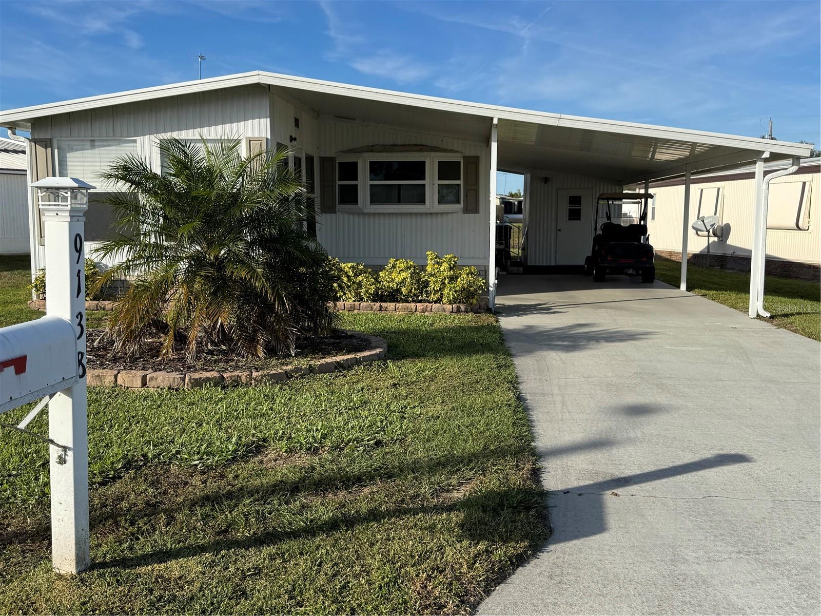 CHECK OUT THIS NICELY MAINTAINED HOME in this desirable 55+ waterfront community just east of Lake Wales. 2-bedrooms, 2-bathrooms, fully furnished, on a pond. This home has a metal roof, AC was replaced in 2020, plumbing re-piped in November 2023, new carpet and luxury vinyl was installed in 2024. There is a shed/laundry room. The windows were replaced recently. The property backs up to a small pond. If you want a peaceful place to retire to or to live in year-round, you need to see this home. There is an optional share program that you can purchase that allows you to use all of the amenities that this community offers. The regular HOA fee covers the roads maintenance. This is a very sought after community, so make an appointment for your showing soon!