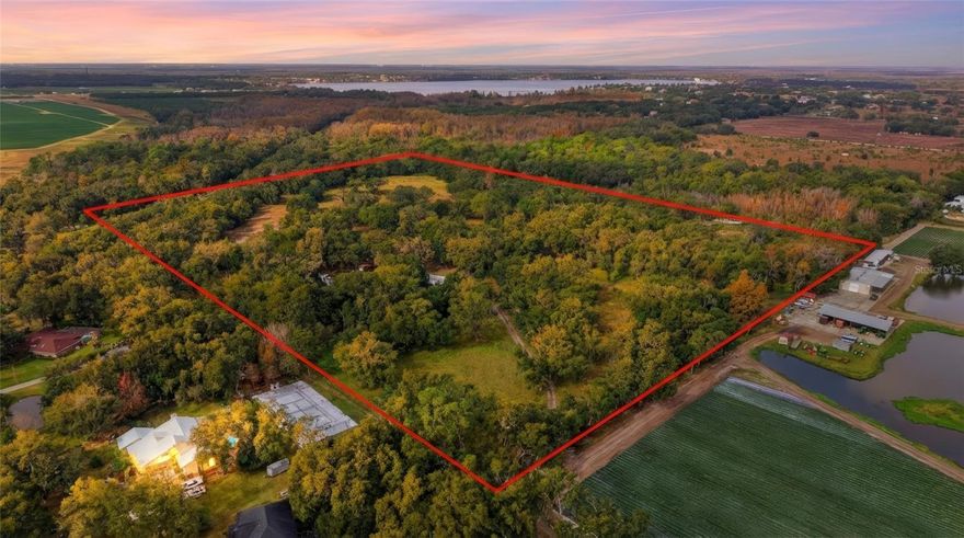 Welcome to 12454 Browns Berry Road in Dover, Florida — a unique 30-acre opportunity nestled in a peaceful conservation setting. This expansive property includes two parcels: one 5-acre AG-residential lot and one 25-acre agricultural lot, both fully fenced with a mix of open pasture, mature oaks, and natural creek frontage. The land features two wells installed in 2022, two septic systems, and four structures — including a 2-bedroom, 2-bath home in need of renovation, two mobile homes, and a shed. Ideal for someone looking for a private homestead, working farm, or future development, the property is currently home to farm animals that will convey with the sale. Bakers Creek borders the west side and another creek runs through the east side, enhancing the natural beauty and potential of the land. Additionally, three acres are owned across Pemberton Creek in a custom home community, adding further value and possibilities. Access is via Browns Berry Road, which includes a 10-foot easement, and alternative entry points may be available through Pemberton Creek or adjacent property currently zoned PD. Whether you're looking for a rural retreat, agricultural investment, or prime development opportunity, this one-of-a-kind property offers unmatched flexibility in a scenic, tucked-away location.