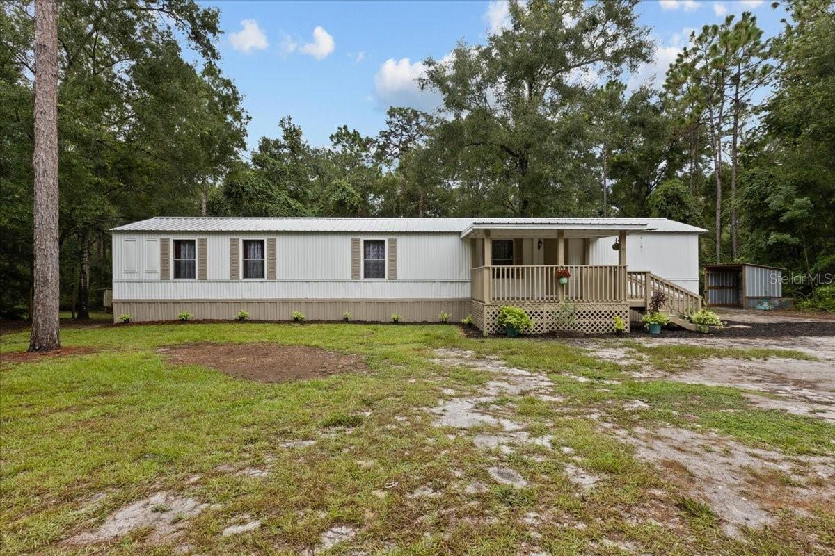 Are you looking for a super affordable home in the country? Look no further , this extremely well kept 2 bedroom/2 bathroom home located on .28 acres in Chiefland, Florida is the perfect place to call home. NW 58th street only has two homes on making it nice and private. This home was just freshly painted and has nice open floor plan , as you enter the home you see the open living room, space for a dining room table and open kitchen . A true split floor plan with a bedroom and bathroom on each side. Master bedroom is spacious with an updated master bathroom shower. A front porch as well as a nice back porch to enjoy the peaceful outdoors. Back porch could easily be enclosed if you needed extra space. Laundry room is on the back porch as well and enclosed. Cool smoke house or covering for your grill as well. The perfect size lot for low maintenance. Accepting cash, conventional or VA loans, call today for YOUR tour!