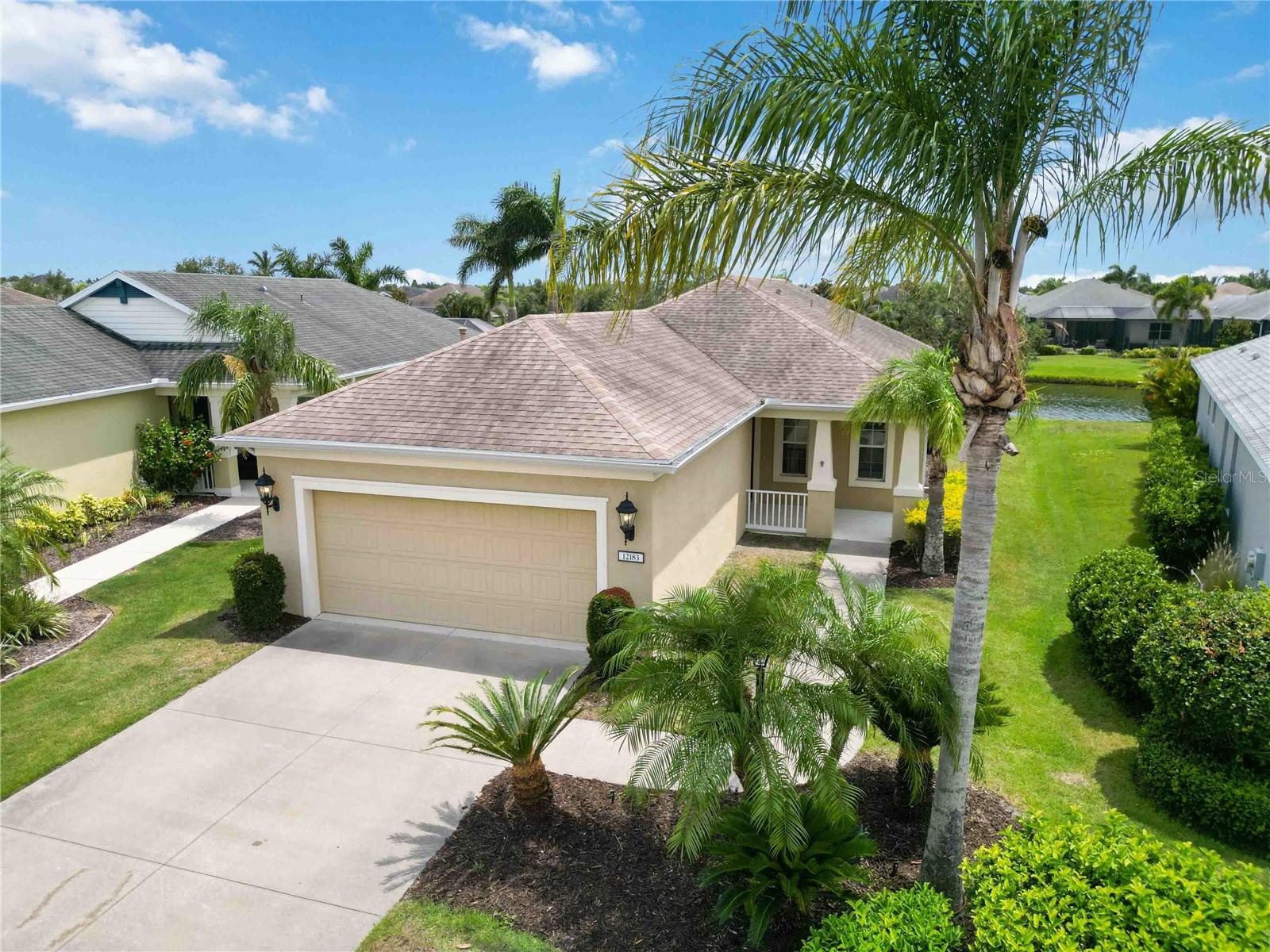 One or more photo(s) has been virtually staged. NEW HURRICANE IMPACT WINDOWS INSTALLED JUNE 2025. Enjoy the stunning WATER VIEWS from home in the highly desirable, gated community of Central Park in Lakewood Ranch. This three bedroom + den/office + separate dining room or play area, two full baths, a designated laundry room with a huge storage closet and a great room has everything you need! With plenty of bright natural light, this open floor plan is perfect for entertaining. A/C Change Out (2019). This gated community offers resort-style amenities including a 10-acre park, new playground, splash pad, two dog parks, sports fields, tennis & pickleball courts, a community pavilion and social events for everyone! - all with a LOW HOA! Being in Central Park will also have you in a PRIME LOCATION with TOP RATED schools just outside your gates and convenience to every day needs & entertainment. Located in the heart of Lakewood Ranch you have easy access to recreational trails, hospitals, Lakewood Ranch Main Street & Waterside Place, University Town Center, premier golf courses, Sarasota/Bradenton International Airport, top-rated beaches, shops, dining and much more! Homes in Central Park don’t last long—schedule your showing today!