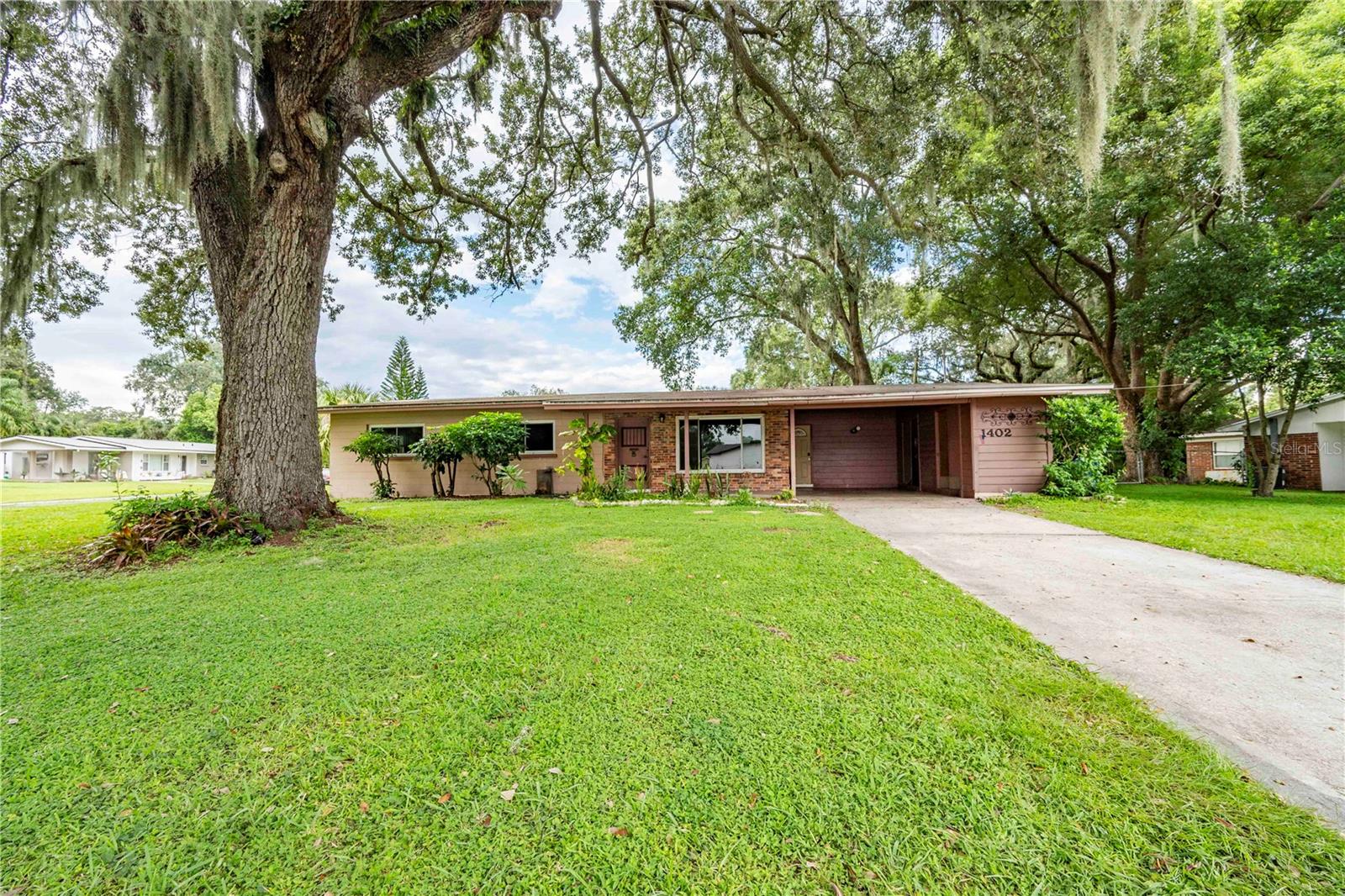 Discover this stunning Mid-Century Modern gem, perfectly situated on a spacious corner lot in the highly sought-after Lake Hollingsworth neighborhood. This beautifully maintained home features elegant Terrazzo flooring, a new roof (2017), a brand-new A/C system, a new hot water heater, and completely updated plumbing—offering both style and peace of mind. Enjoy the convenience of being just minutes from the Parkway and vibrant Downtown, with scenic Lake Hollingsworth right around the corner.