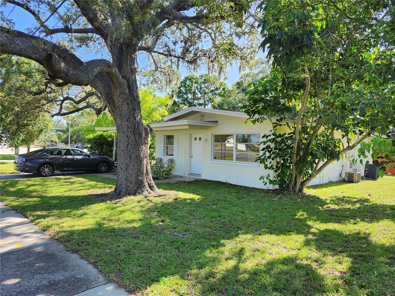 Great flexible space. Currently zoned Single Family Residence. The home has been a rental. The home is two 1 bedroom/1bath units with 2 entrances, 2 driveways, 1 carport, separate kitchens, 2 washer and dryer units, 2 A/C and 2 water heaters. Home is on septic. The property would be great for a mother in law or a way for someone to share expenses. Or a great opportunity for someone that works from home. Endless possibilities. Great location, easy access to many restaurants, stores, walk to the East West trail. Check it out today. NO HOA and NON-Evacuation zone. Since it is on McMullen Booth Road surrounded by businesses, it may be possible to change zoning. Please check with the City of Clearwater. Pictures of the front unit. Photos of back unit coming soon