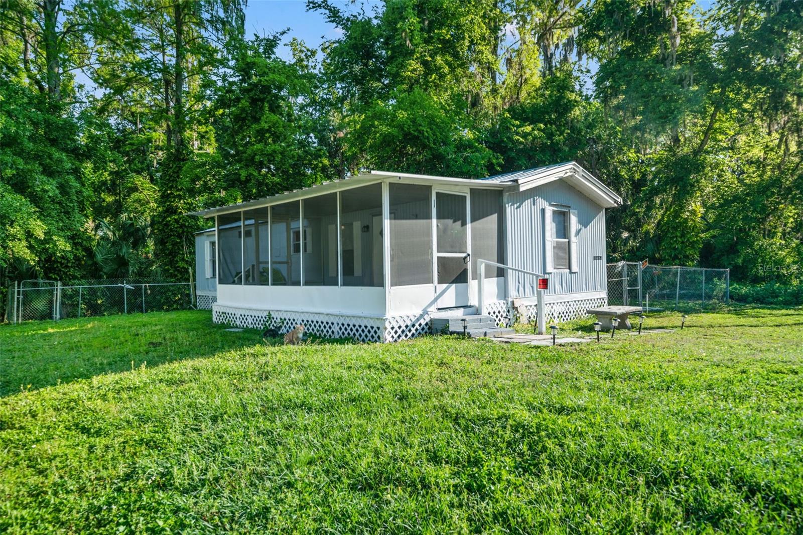 RICED REDUCED!!! Updated 2/1 Lake Panasoffkee home with a newer metal roof. Improvements include NEW flooring, NEW fresh paint on the interior and exterior, UPDATED bathroom with tile shower, and NEW fans and lighting. This home offers covered back and front porches! Plenty of space to relax or sip a cup of coffee. Split plan with open Kitchen and Living area. Back yard is fenced and has a small storage shed. Affordable living where you OWN the land - NO HOA/NO CDD/NO FLOOD ZONE!!! Located near Lake Panasoffkee, The Withlacoochee River, shopping, local restaurants, public boat ramps, golfing, and entertainment. Near I-75 and Turnpike for access to Tampa, Orland and Florida's beaches. Call today for your appointment to view!
