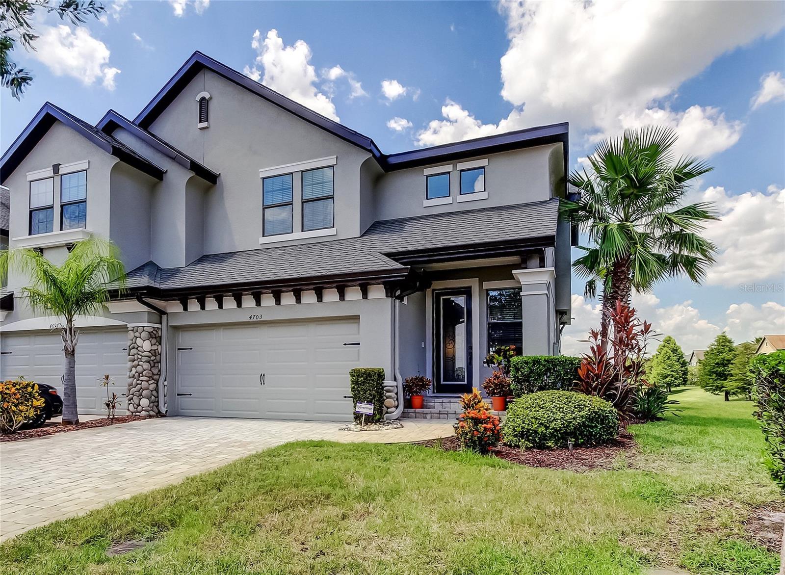 PICTURE PERFECT AND SHOWS LIKE A MODEL. THIS GORGEOUS END UNIT TOWNHOME WITH A BEAUTIFUL WATERFRONT VIEW, WILL NOT LAST. LOCATED IN A GATED COMMUNITY, THIS 3 BED, 2.5 BATH AND 2 CAR GARAGE IS SIMPLY STUNNING. ENTER THRU THE UPGRADED GLASS DOOR TO A FOYER AND TAKE A COUPLE STEPS DOWN TO THE GREAT ROOM AND DINING AREA. TO YOUR LEFT YOU WILL FIND THE DEN AREA WITH CUSTOM CABINETRY AND BUILT-IN DESK. THE KITCHEN, DINING AND BREAKFAST NOOK ARE OPEN TO THE GREAT ROOM THAT LEAD OUT TO YOUR EXTENDED LANAI OVERLOOKING THE LAKE. DESIGNER 42" UPPER KITCHEN CABINETS, GRANITE COUNTER TOPS, STAINLESS STEEL APPLIANCES AND LARGE CENTER ISLAND. THERE IS A 1/2 BATH ON THIS FIRST FLOOR. HEADING UPSTAIRS YOU WILL FIND THE 2 GUEST BEDROOMS, LAUNDRY ROOM AND THE PRIMARY SUITE WITH A DOUBLE DOOR ENTRY. ENJOY WAKING UP EVERY MORNING WITH YOUR WATERFRONT VIEW AND THE BALCONY RIGHT OFF YOUR BEDROOM. GENEROUS SIZE WALK-IN CLOSET WITH ALL THE BUILT-INS. THE ENSUITE BATH OFFERS SEPARATE SINK AREAS, GRANITE TOPS, PRIVATE COMMODE AREA AND A GARDEN TUB. THE OUTSIDE OF THE TOWNHOME HAS JUST BEEN PAINTED BY THE ASSOCIATION, BEAUTIFUL PAVER DRIVEWAY ADDS TO THE LUXURY OF THIS COMMUNITY. AMENITIES INCLUDE A POOL, CABANAS, DOG PARK, BBQ AREA AND A FIRE PIT. CALL TO SEE THIS TODAY!