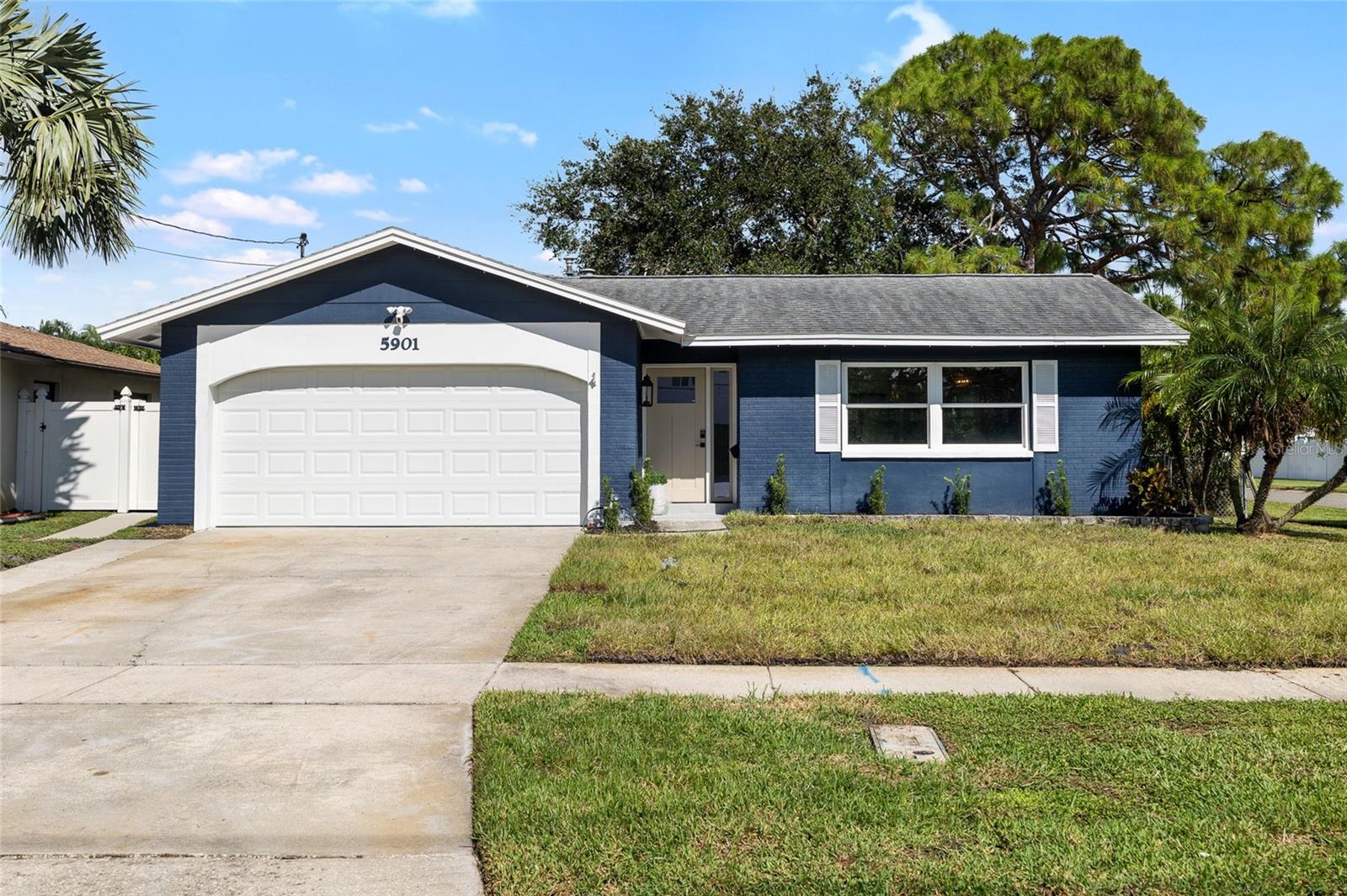 Welcome to this beautifully remodeled 3-bedroom, 2-bath home, perfectly situated on an oversized .18-acre corner lot in the highly desirable Shore Acres community of St. Petersburg. This stunning 1,373 sq. ft. residence has been meticulously updated with a thoughtful blend of timeless style, modern finishes, and major system upgrades, offering the perfect balance of function and comfort. At the heart of the home is a chef’s dream kitchen designed to impress. Featuring dual-tone custom solid wood cabinetry with dovetail soft-close drawers, sleek quartz countertops, and premium finishes, this space is ideal for everything from weeknight meals to large gatherings. The kitchen flows seamlessly into the open living and dining areas, creating a light-filled space that’s as inviting as it is practical. Both bathrooms have been completely remodeled to showcase a modern, spa-like design with clean lines, contemporary fixtures, and tasteful details. Each of the three bedrooms offers generous space, natural light, and versatility to fit a variety of lifestyles—whether you need a private retreat, guest room, or home office. Step outside and experience true Florida living. The covered lanai is the perfect spot for morning coffee or evening cocktails, while the expansive private yard provides endless opportunities for outdoor enjoyment. Whether you envision family barbecues, room for a pool, or simply space for pets and play, this property offers it all. The home also features a two-car garage and an extended driveway with enough depth to accommodate up to six vehicles, ensuring ample parking and storage. Every detail of this home has been carefully considered, from the high-quality finishes inside to the generous outdoor space, making it a rare find in today’s market. Ideally located just minutes from parks, schools, shopping, and the vibrant dining, arts, and entertainment of downtown St. Petersburg, this home delivers the best of both convenience and lifestyle. Move-in ready and thoughtfully updated, it combines style, comfort, and functionality into one unbeatable package. Don’t miss the opportunity to call this exceptional Shore Acres property your new home!