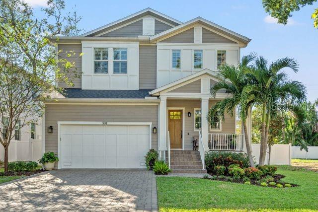 Situated in the prestigious waterfront community of Davis Islands, this beautiful Modern Farmhouse with coastal influences offers a rare blend of timeless design and modern finishes. Built in 2018 and thoughtfully upgraded, this home features 4 bedrooms, 3.5 baths, office, plus loft area all in a spacious 3,177 sq ft residence. The inviting exterior features clean lines, a soft gray and white color palette, and charming architectural details such as board-and-batten siding and a welcoming front porch. Perfectly positioned just minutes from Downtown Tampa, this home combines the best of island charm and city convenience.
Upon entering, you’re welcomed by an open floor plan flooded with natural light. High ceilings, hand-scraped wide plank wood flooring, and enhanced crown molding create a sense of elegance throughout the space. The main living area seamlessly integrates with the recently renovated gourmet kitchen, designed to impress. At its heart is a large central island with Quartz countertops, waterfall edge and plenty of storage. The island is surrounded by modern light wood cabinetry that adds warmth and sophistication. A gas range, stainless steel appliances and full quartz backsplash, complete this dream kitchen, while the adjacent dining area offers the perfect setting for entertaining with a view of the living room. The primary suite is a retreat unto itself, boasting high tray ceilings, expansive picture windows, and a double-sized walk-in closet. The en-suite bathroom features dual Quartz vanities, shaker cabinetry, and an oversized frameless walk-in shower. Upstairs, a versatile loft area provides an additional living space, ideal for a media room, playroom, or office. The second floor also includes three generously sized bedrooms and two additional full bathrooms, ensuring comfort for family or guests. On the main level, a guest room or study with storage adds to the home’s thoughtful design. The outdoor space has been expanded to elevate your lifestyle. A raised, screened deck offers a private oasis for dining and relaxation, while the artificial turf ensures a beautiful, low-maintenance lawn year-round. The recently installed vinyl fence provides both privacy and durability, and with pre-plumbed gas and electric connections, there’s plenty of room to add a pool to complete your outdoor retreat. Additional features include impact windows for safety and efficiency, plantation shutters throughout, a tankless water heater for on-demand hot water, prewiring for cable and underground electric. Located on Davis Islands, this home is part of a vibrant community known for its upscale, walkable lifestyle. Residents enjoy amenities such as the Marjory Park Marina, Sandra Freedman Tennis Complex, Peter O. Knight Airport, the historic Roy Jenkins Pool, and walking trail. The community also offers proximity to Water Street, Sparkman Wharf, the Tampa Riverwalk, and Tampa General Hospital, making it a city within a city while maintaining its laid-back island charm. This home is located within the boundaries of Tampa’s top-rated schools, including Gorrie Elementary, Wilson Middle, and Plant High School. These sought-after schools add to the desirability of this exceptional property. This is a rare opportunity to own a thoughtfully designed home in one of Tampa’s most coveted neighborhoods. Schedule your showing today and experience the best of Davis Islands living!