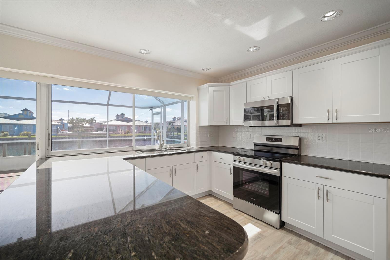 Beautiful 3/2 waterfront rental on canal with a huge screened room. Annual rental ONLY. Carefully renovated. No fixed bridges Home also for sale. Please call agent for more information.