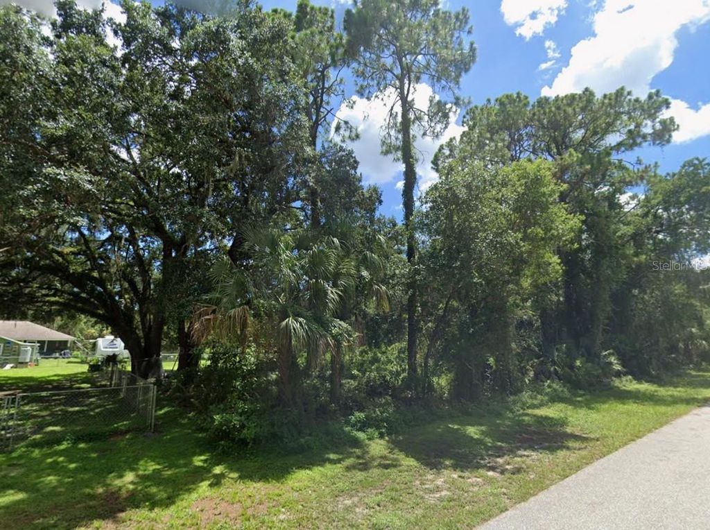 Photo of 16053 Arcaro Avenue, Port Charlotte, FL 33954 (MLS # C7521519)