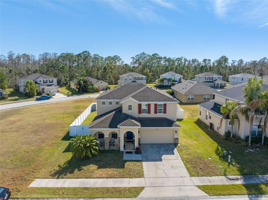 Welcome to this exceptional POOL home in GUARD GATED TRAFALGAR VILLAGE!  Zoned for Short Term & Long Term Rentals and also perfect for your primary Florida residence! Enjoy ultimate privacy with ONLY ONE NEIGHBOR and a fully fenced backyard - perfect for relaxing, entertaining, or hosting guests. This home features an amazing, highly functional floor plan with TWO SPACIOUS PRIMARY SUITES - ONE ON EACH FLOOR - ideal for multi-generational living. This property offers both lifestyle and income potential. The HOA PROVIDES OUTSTANDING VALUE: full pool service (chemicals included!), lawn care (excluding shrubs), DAILY garbage removal (minus Sunday) —making ownership truly low maintenance.  HOA includes a large pool area, playground, dock, volleyball and basketball. This home checks all the boxes with space, pool, privacy, convenience, and resort-style community features! Come and see all this amazing home has to offer!