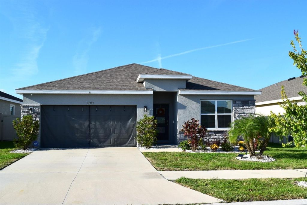 Photo of 31871 Treasure Dock Isle Isle, Wesley Chapel, FL 33545 (MLS # TB8427627)