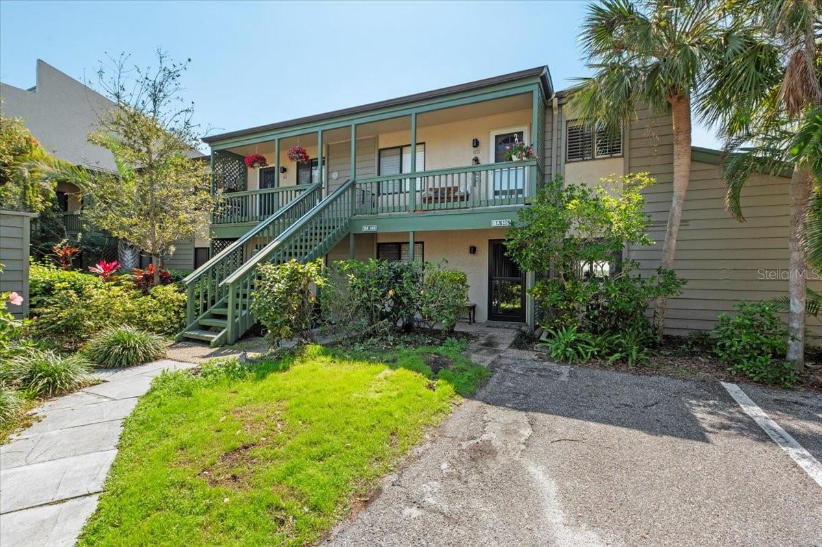 Your Pelican Cove experience begins when the front gate lifts and the beauty of Pelican Cove unfolds. A rare opportunity to own a condo with breathtaking water views from every window. This spacious THREE bedroom/THREE bath condo is filled with plenty of natural sunlight and two separate outdoor spaces along and over $25,000 in home improvements. Simply move-in and take in the tranquil Little Sarasota Bay and marvel at the dolphins, manatees, birds, and other wildlife. Enjoy incredible sunsets and star gazing in the evenings from your enclosed lanai. This ground floor 3 bed/3 bath condo features generous open floor plan, new high-capacity AC system, water heater, and wood flooring throughout. The historic Wilbanks clubhouse is only steps away, where the main heated resort-style pool awaits. Across the way is the private picturesque 87-boat slip harbor. Boat and kayak to Midnight Pass and have direct access to the gulf. Residents gain entry to the unique blend of natural habitats, miles of scenic trails, a fitness room, multiple heated pools and hot tub. There are six new pickleball courts and resurfaced tennis courts with active clubs for play. Many more recreational and cultural events are hosted year around. Robust live music, art and culture, and educational seminars are abundant in season. The community is also conveniently located with shopping and restaurants nearby. Siesta Key and downtown Sarasota are in very close proximity as well. You will love this phenomenal unit in this one-of-the-kind, gated, maintenance-free living community of Pelican Cove.