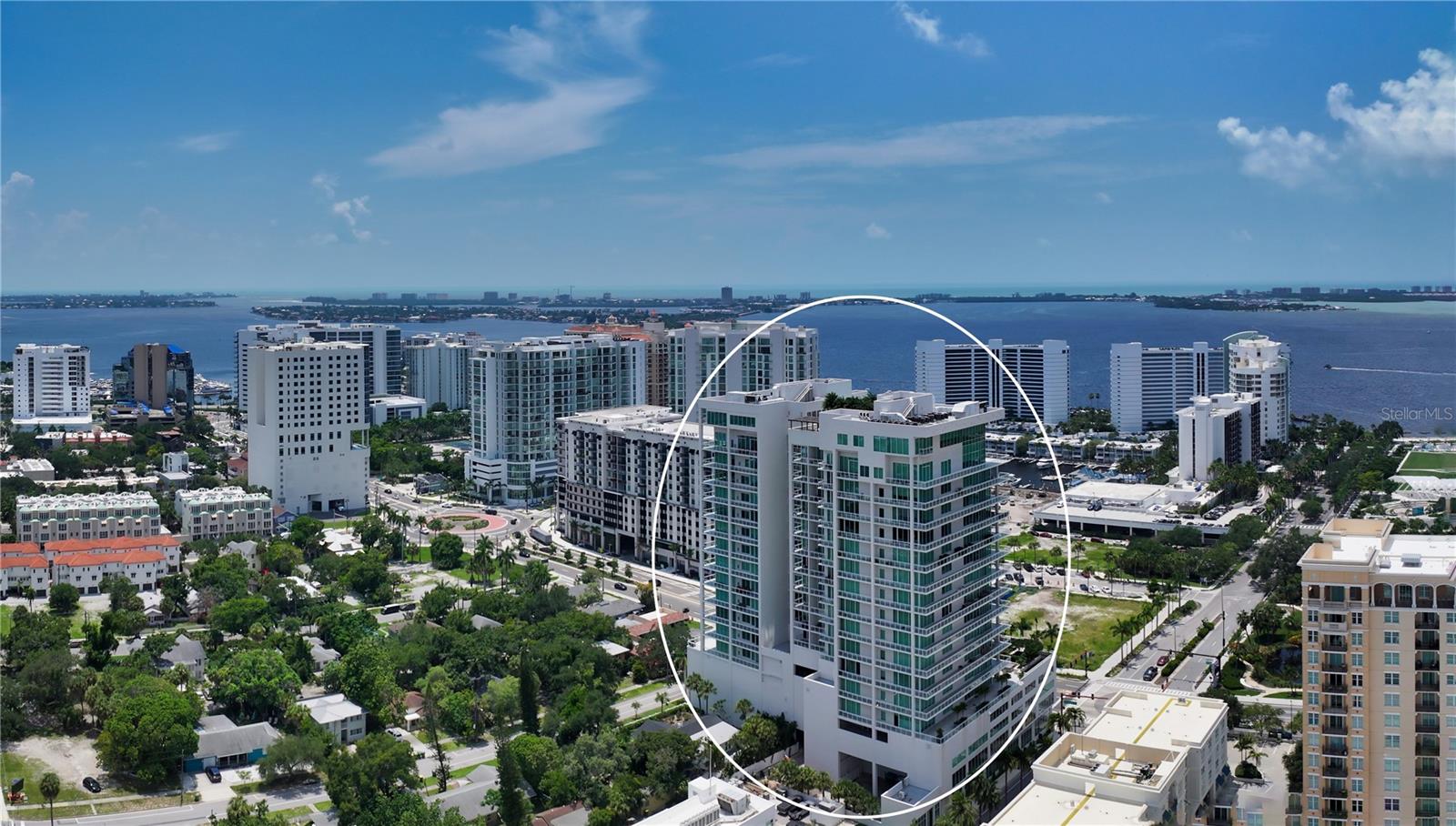 Spectacular views and a spectacular floorplan in this 11th floor newer downtown condominium. Enjoy the private elevator that opens directly to your home in the sky. Boasting close to 4000 sf of interior space, 3 en-suite bedrooms, 3 balconies, wide hallways, expansive rooms, abundant storage and oversized closets, you feel like you are residing in a single-family home while enjoying incredible sunsets over Sarasota bay and north as well as city views to the east. The stunning appointments throughout the unit were selected with a nod to modern design using neutral and classic colors that appeal to all. Amenities in the building include the breathtaking roof-top infinity-edge pool, spa, outdoor kitchen/grill area and cabanas for relaxing and reading. Entertaining is easy and fun with the convenient wine room and individual lockers, the bar and club room with pool table, lounging area both in and outdoors. Practice your golf skills with the computerized driving range or workout in the well-apppointed fitness room. Dog lovers...your furry family members have their own dog grooming room and an outdoor "grassy" dog lawn! This condo comes with 2 parking spots located adjacent to the building entrance on plaza 2 level. Located in the preferred north tower, the concierge is always eager to assist. Easy walkability to Bayfront Park Conservancy, over the bridge or downtown to restaurants, shops, the Library or visit the weekly Farmers Market. You have it all here!